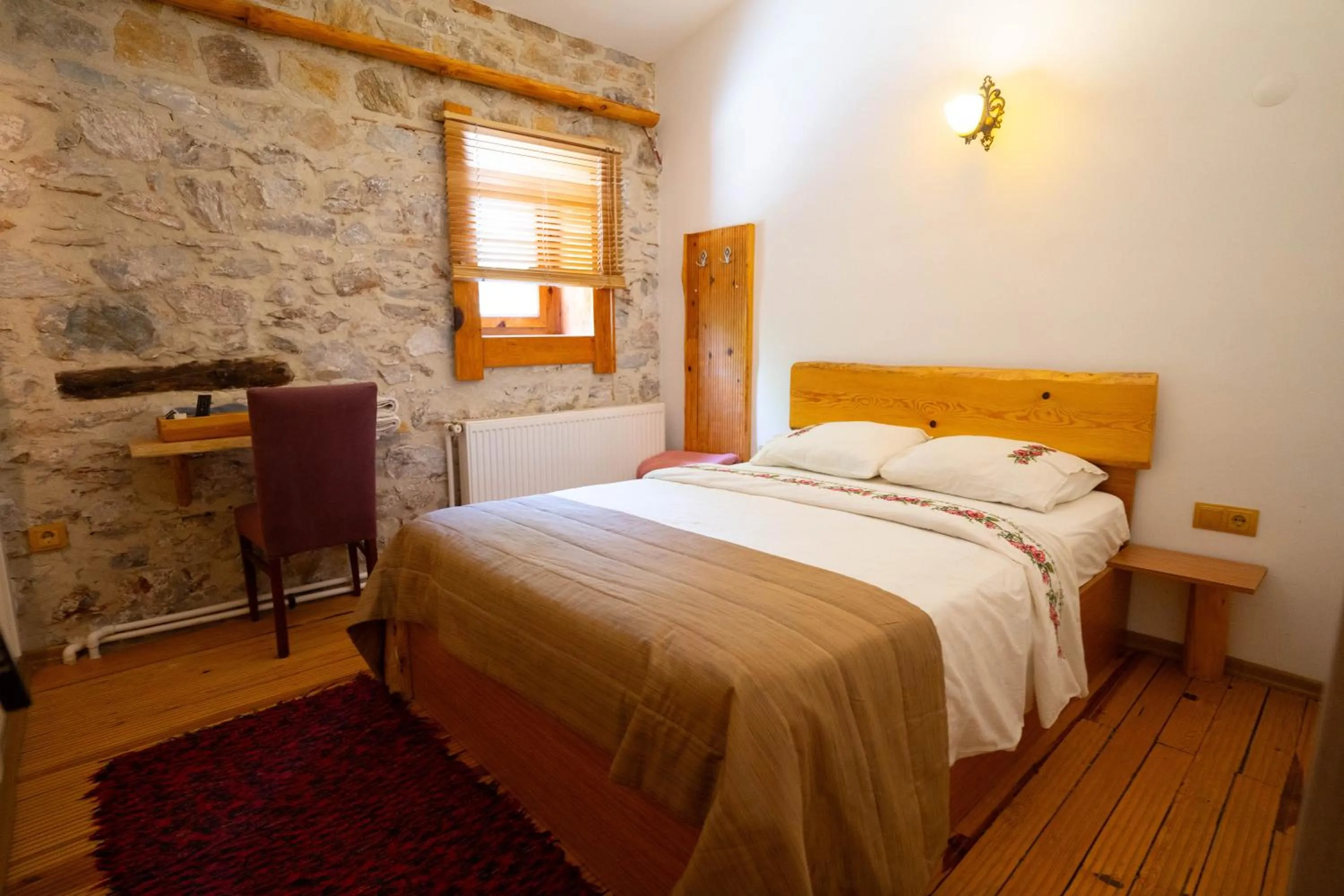 Bed in Mogla Tashan Hotel