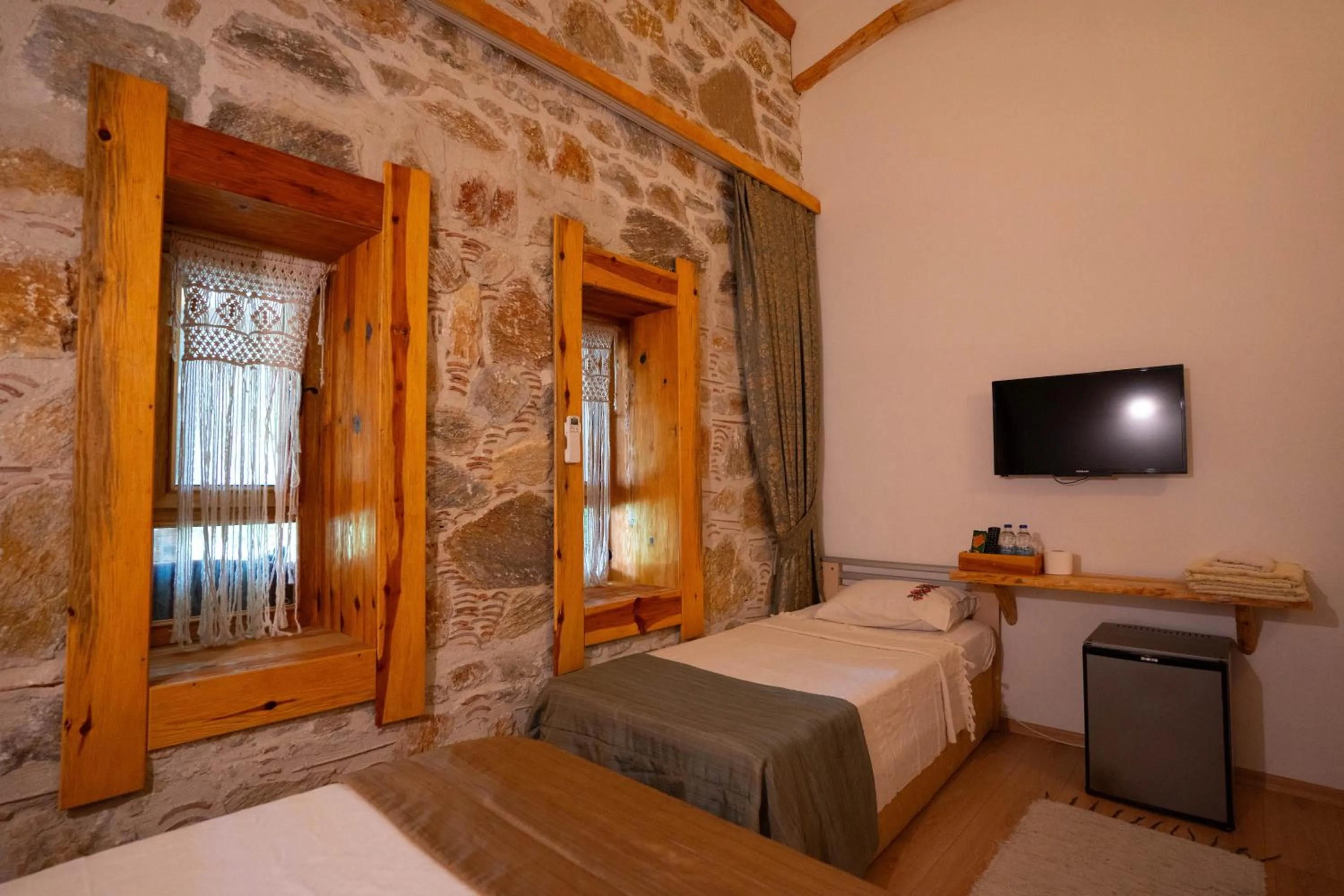 Bed in Mogla Tashan Hotel