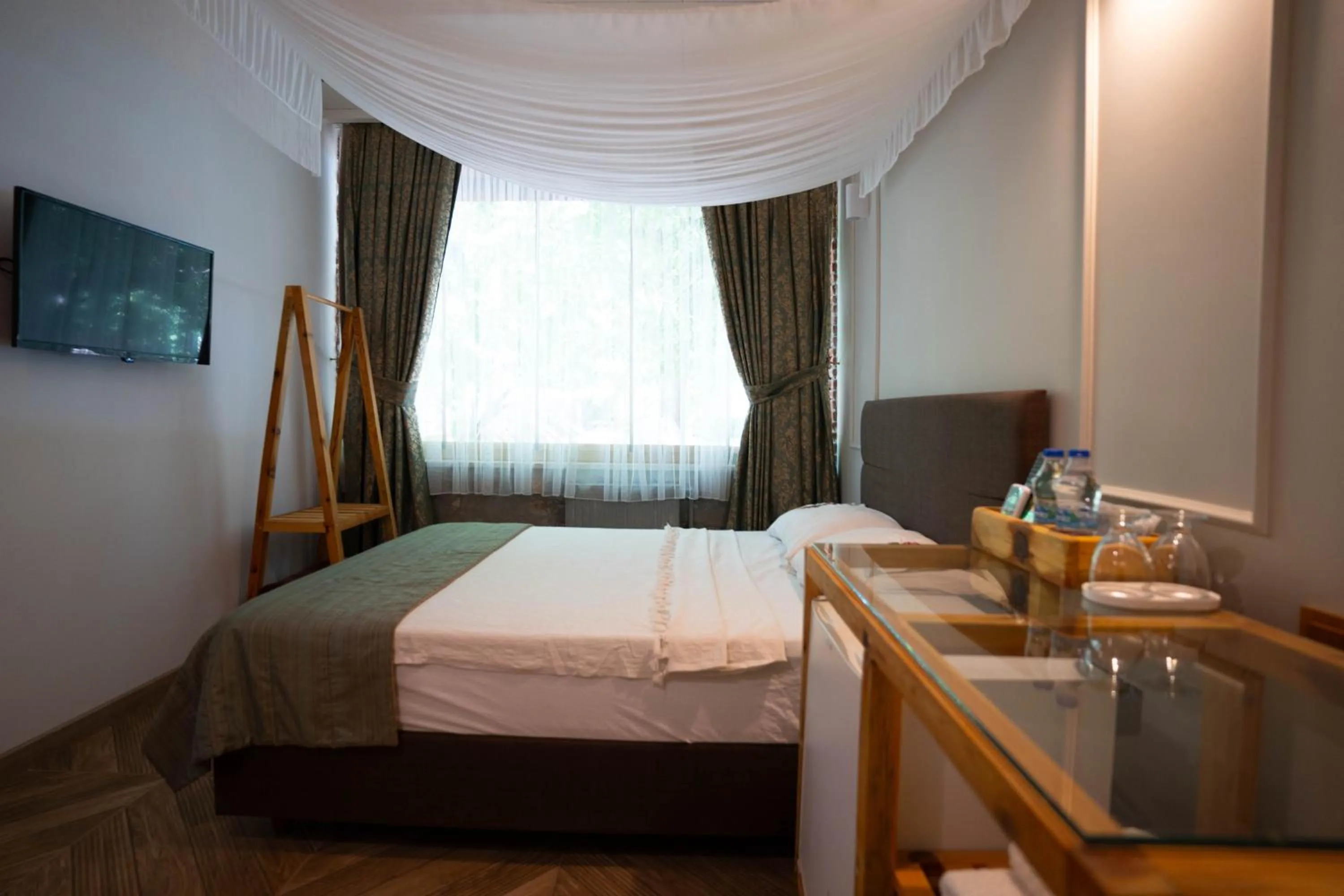 Bed in Mogla Tashan Hotel