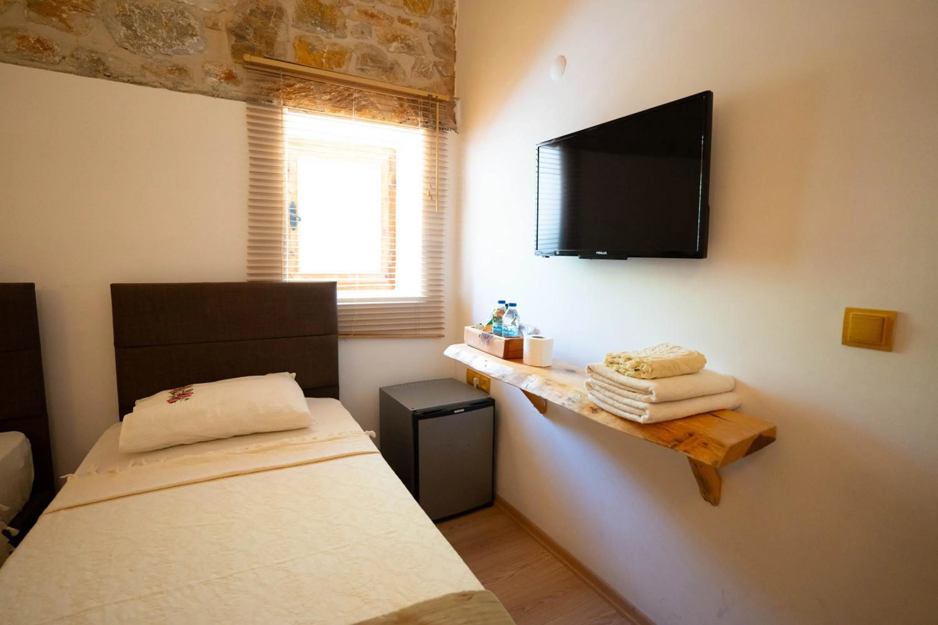 Bed in Mogla Tashan Hotel