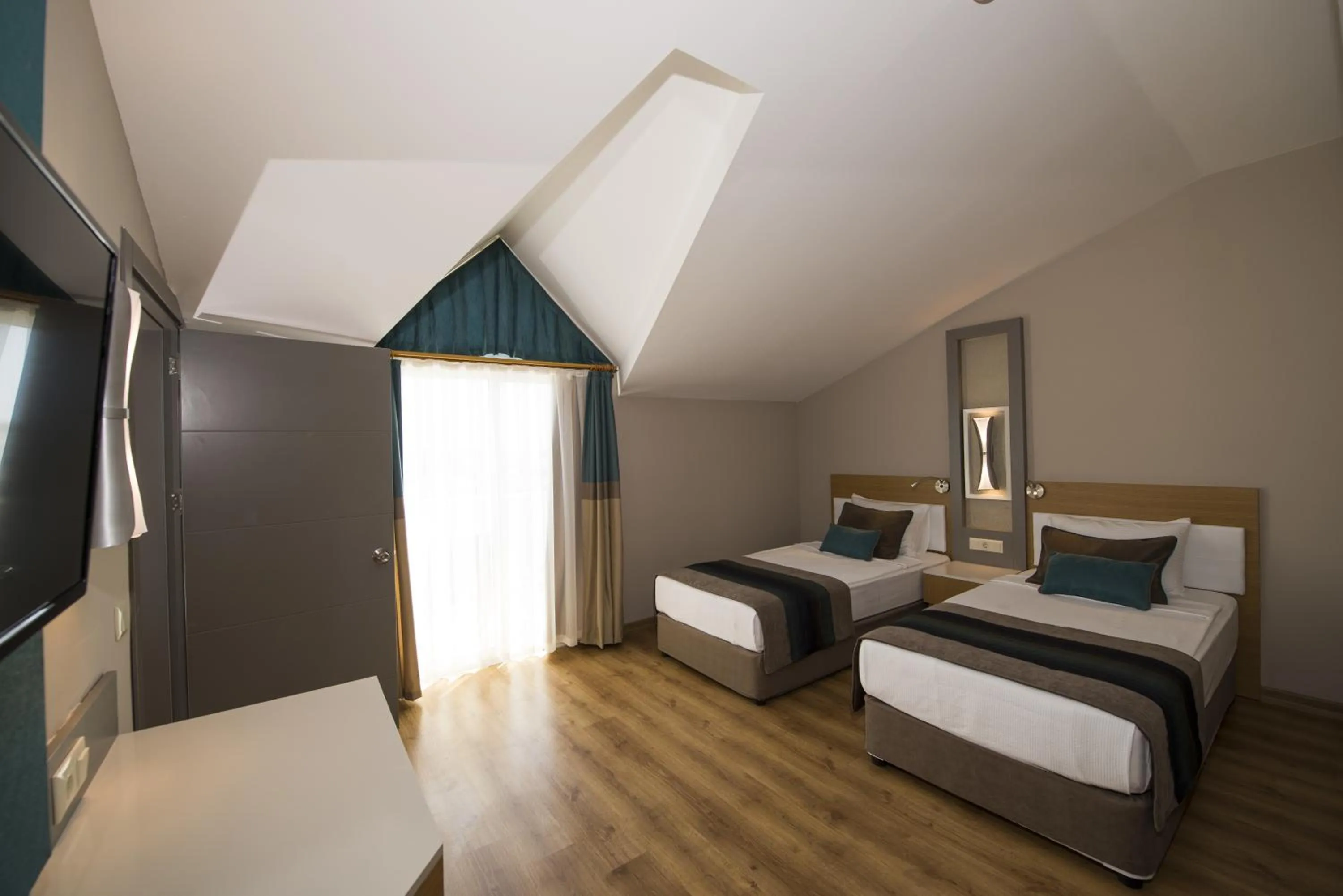 Bed in Palm World Side Resort & Spa