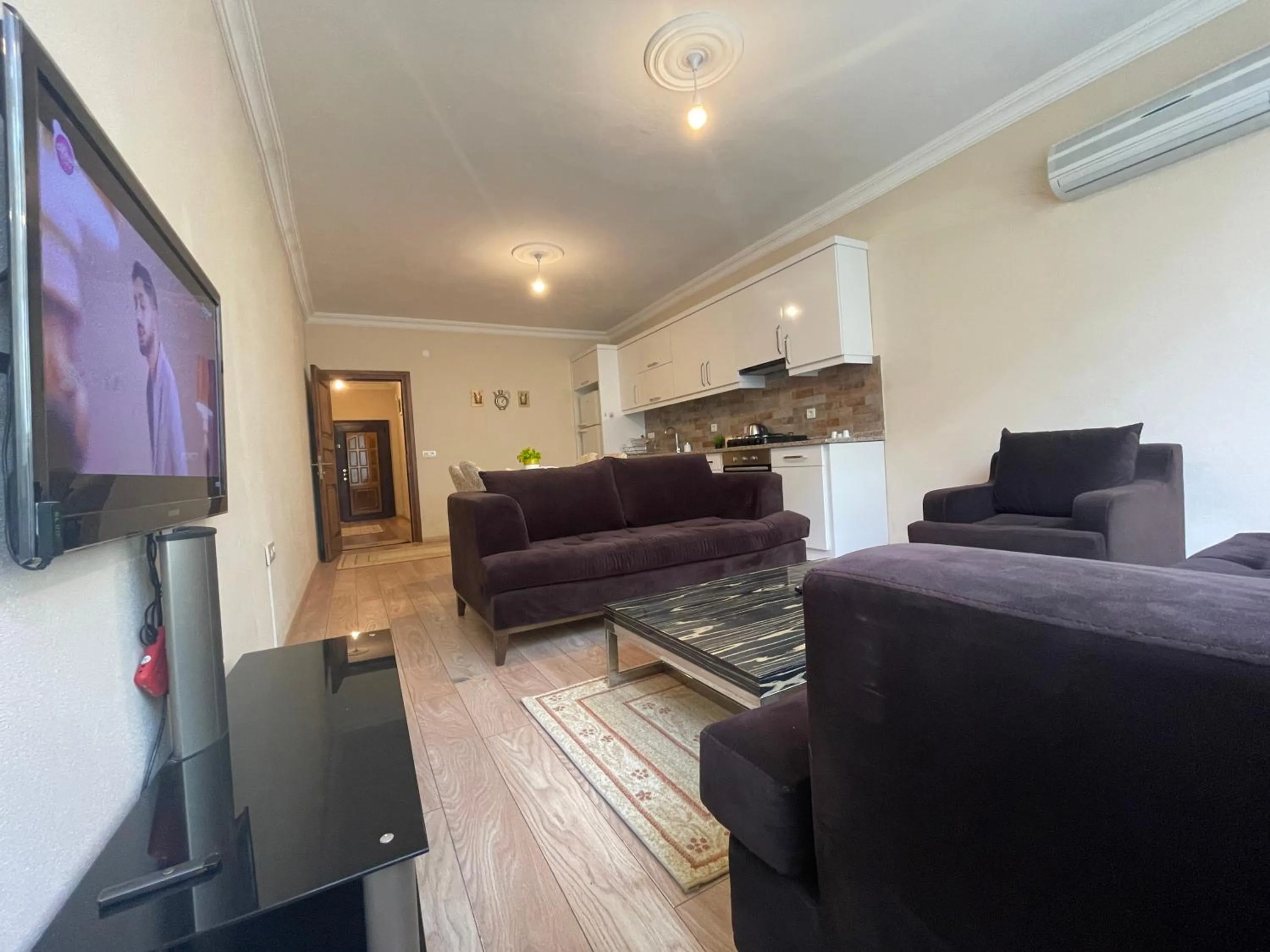 Communal lounge/ TV room in Select Suite & Apart Hotel