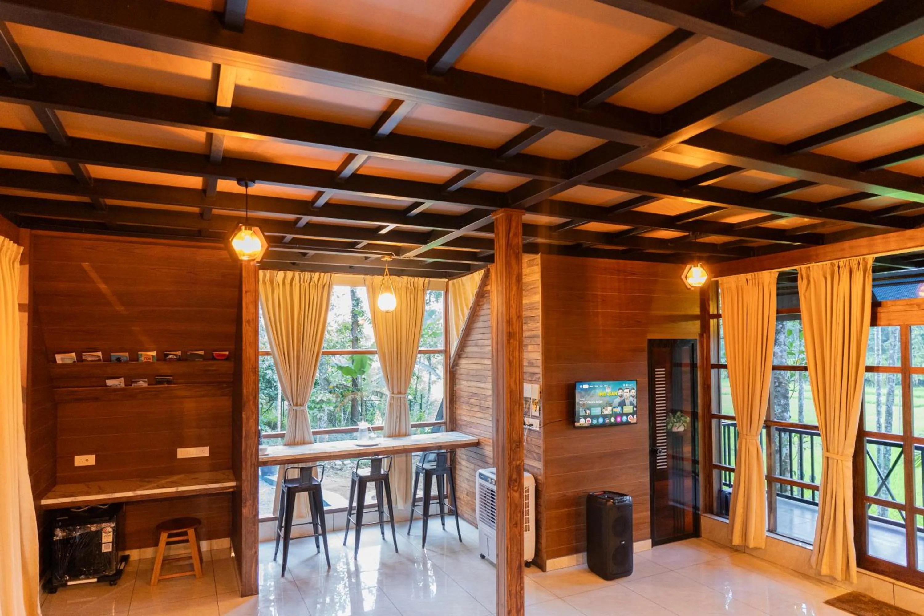Communal lounge/ TV room in Ethnic Villa Wayanad