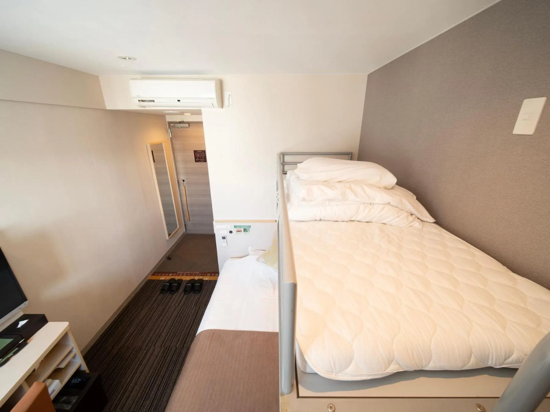 Bed in Super Hotel Premier Akasaka