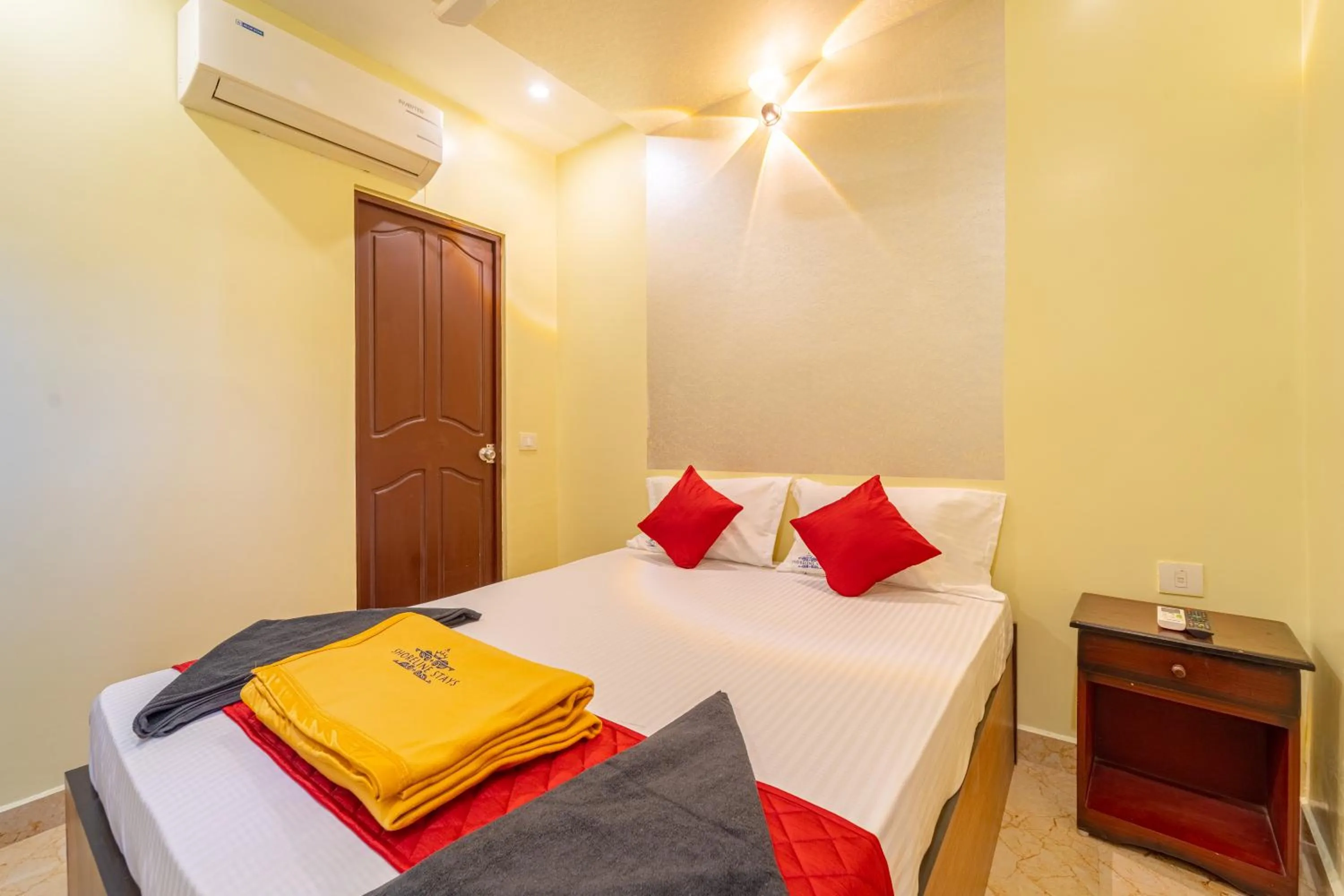 towels, Bed in Shoreline Stays Near Rock Beach