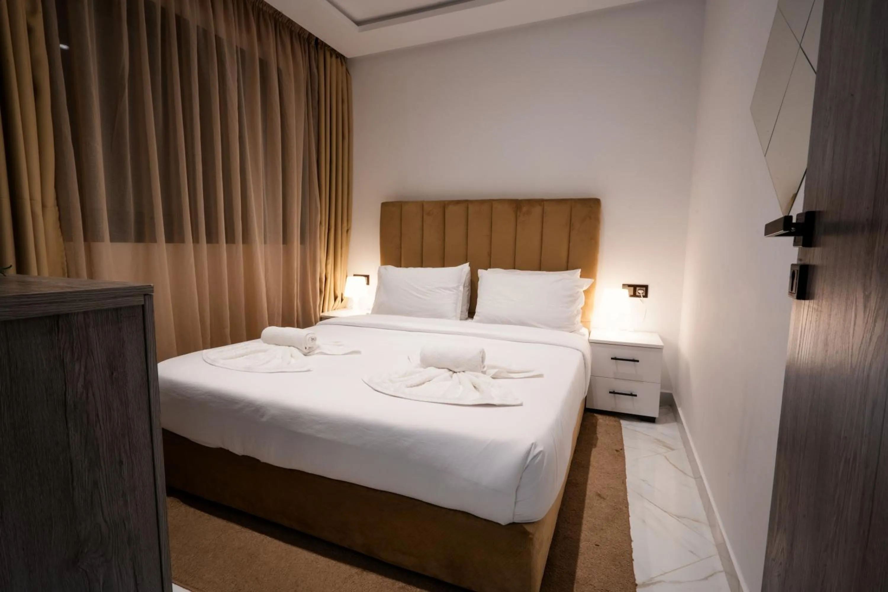 Bed in Amelia Appart-Hotel