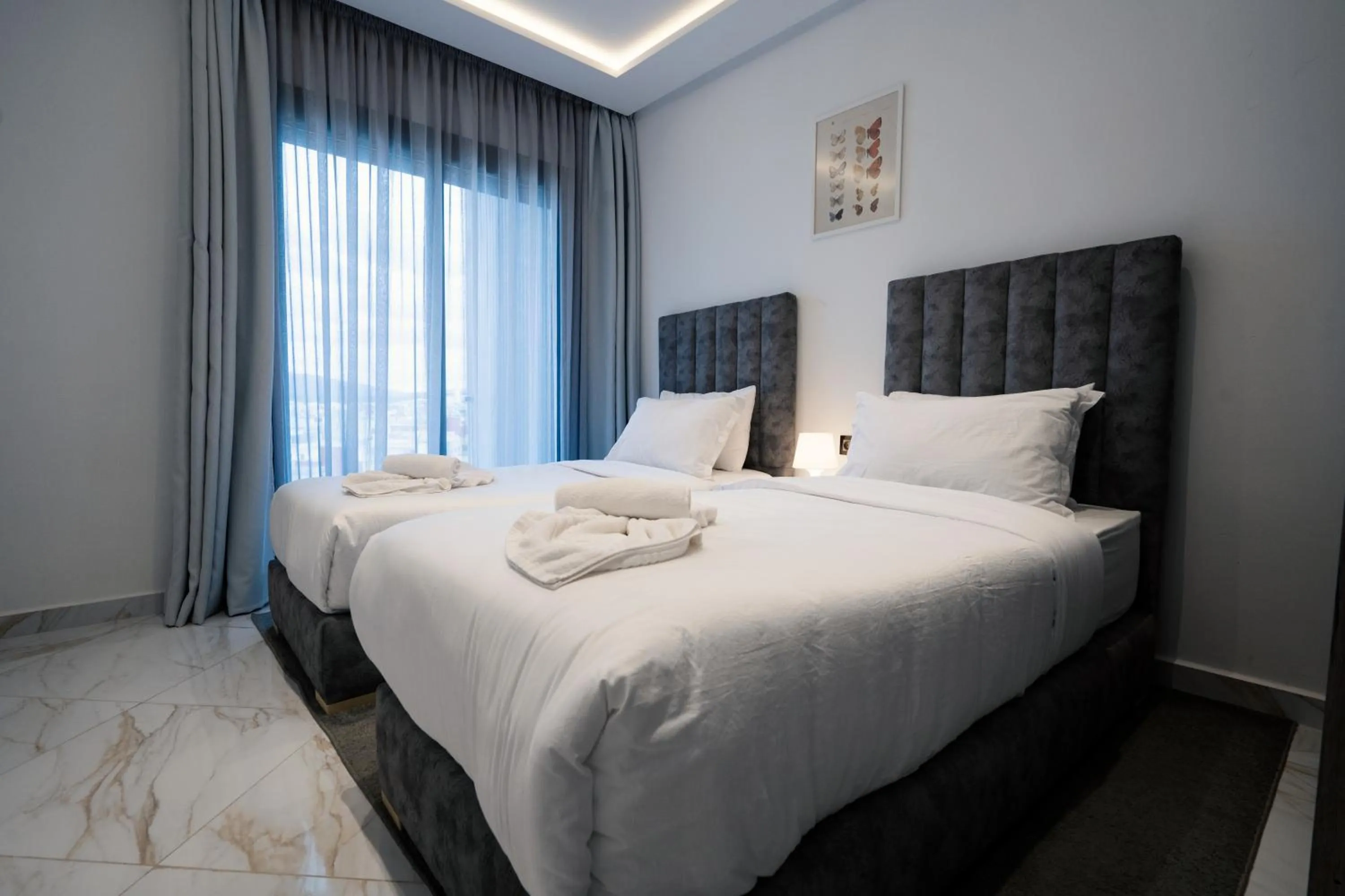 Bed in Amelia Appart-Hotel