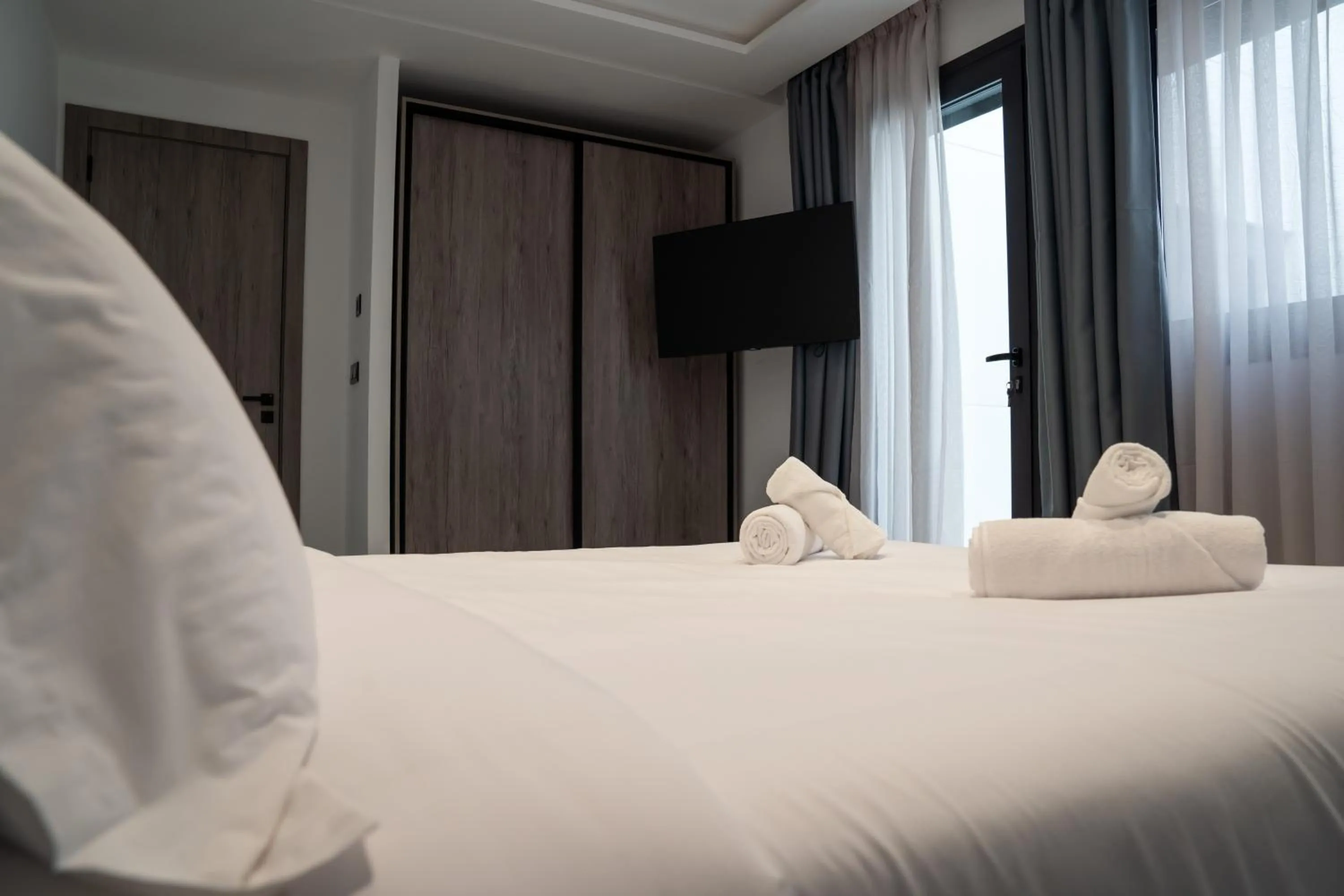 Bed in Amelia Appart-Hotel