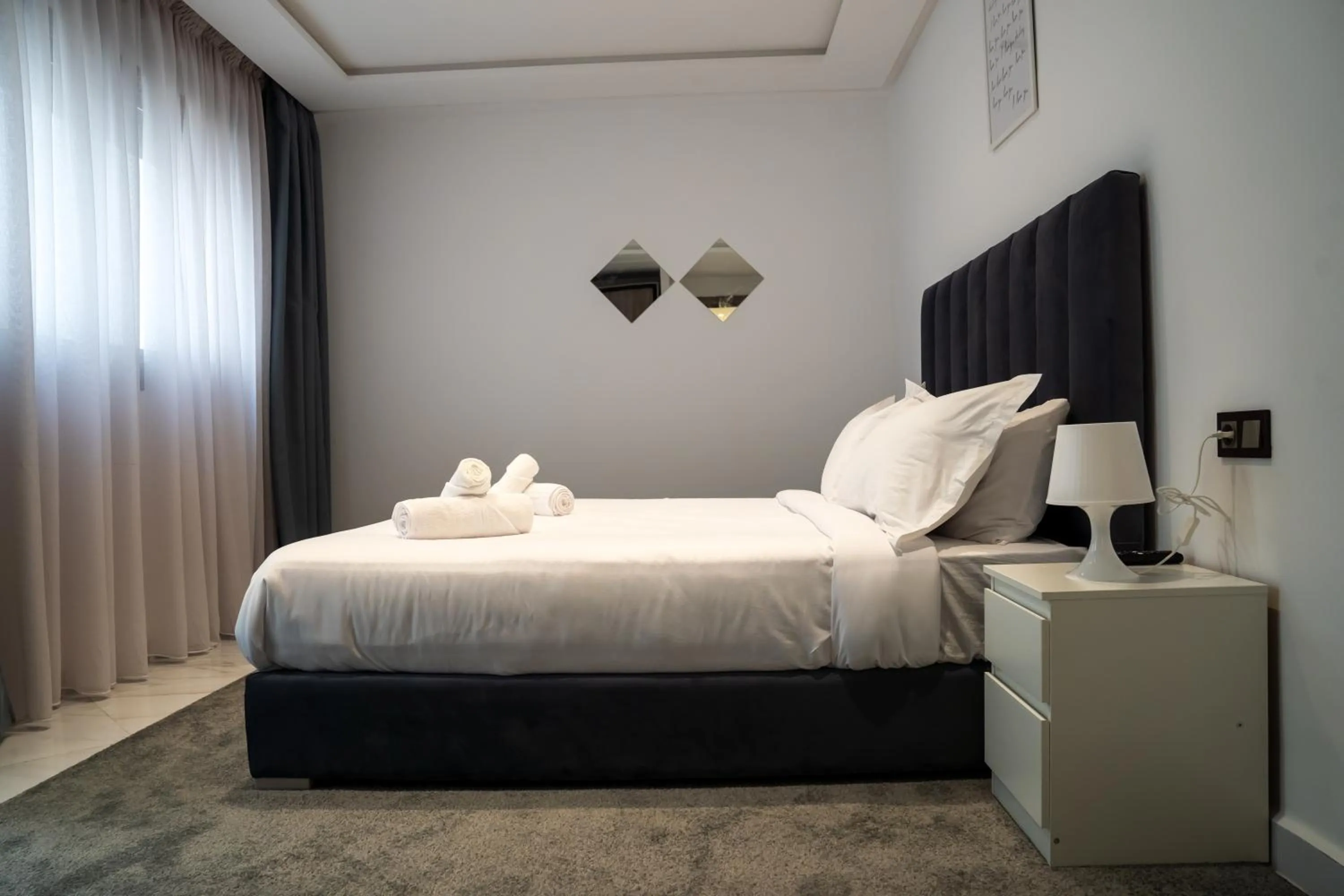 Bed in Amelia Appart-Hotel