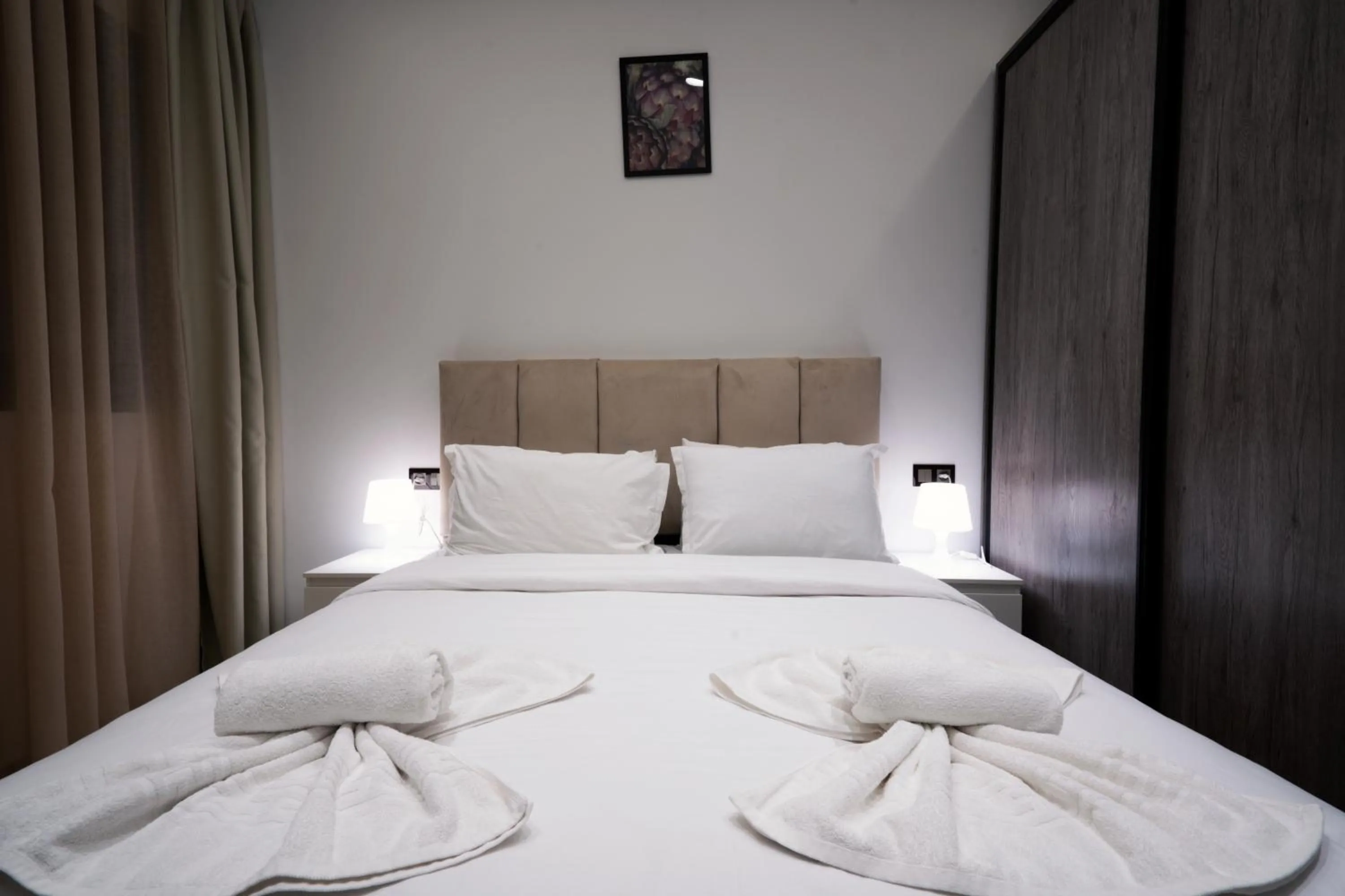 Bed in Amelia Appart-Hotel