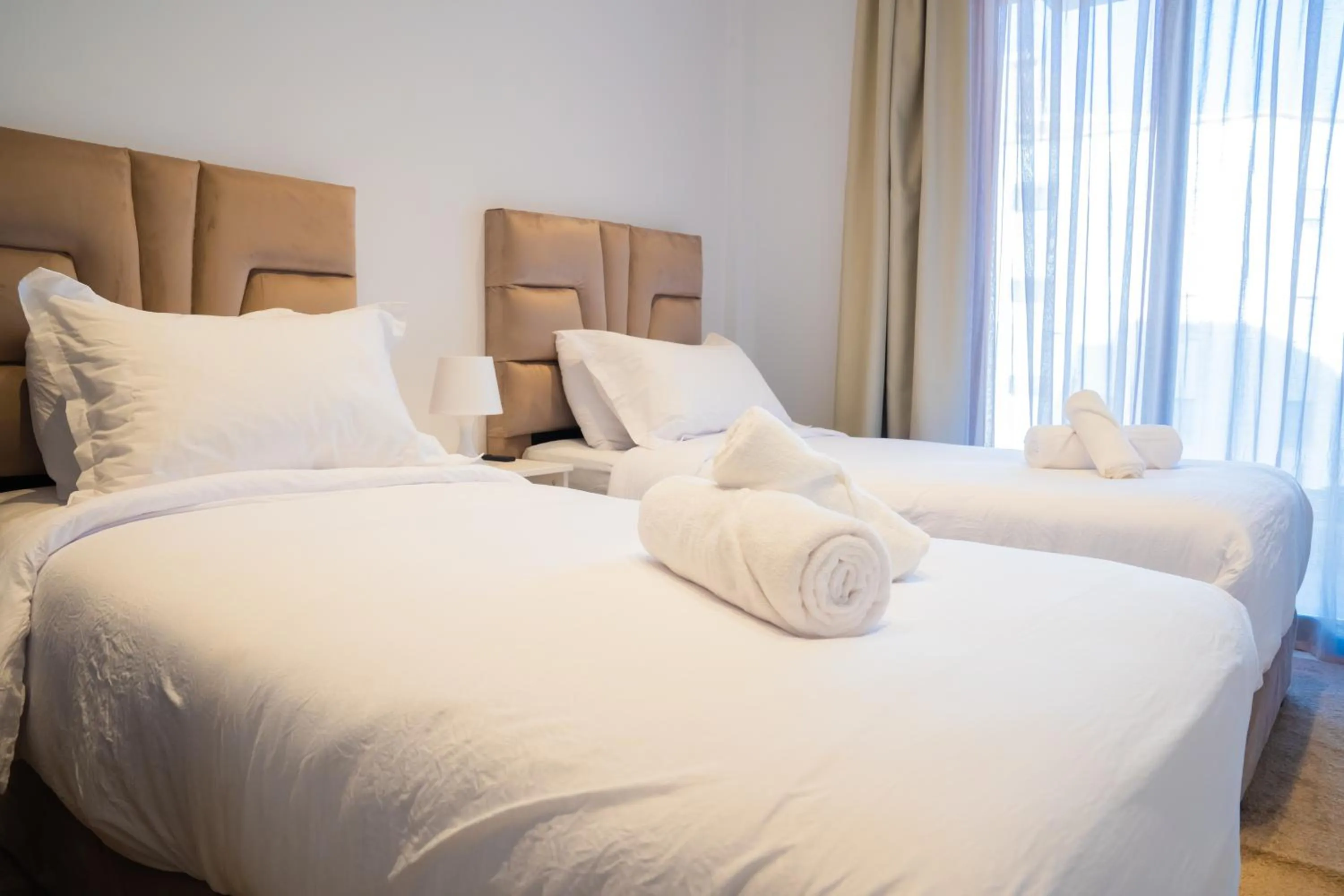 Bed in Amelia Appart-Hotel