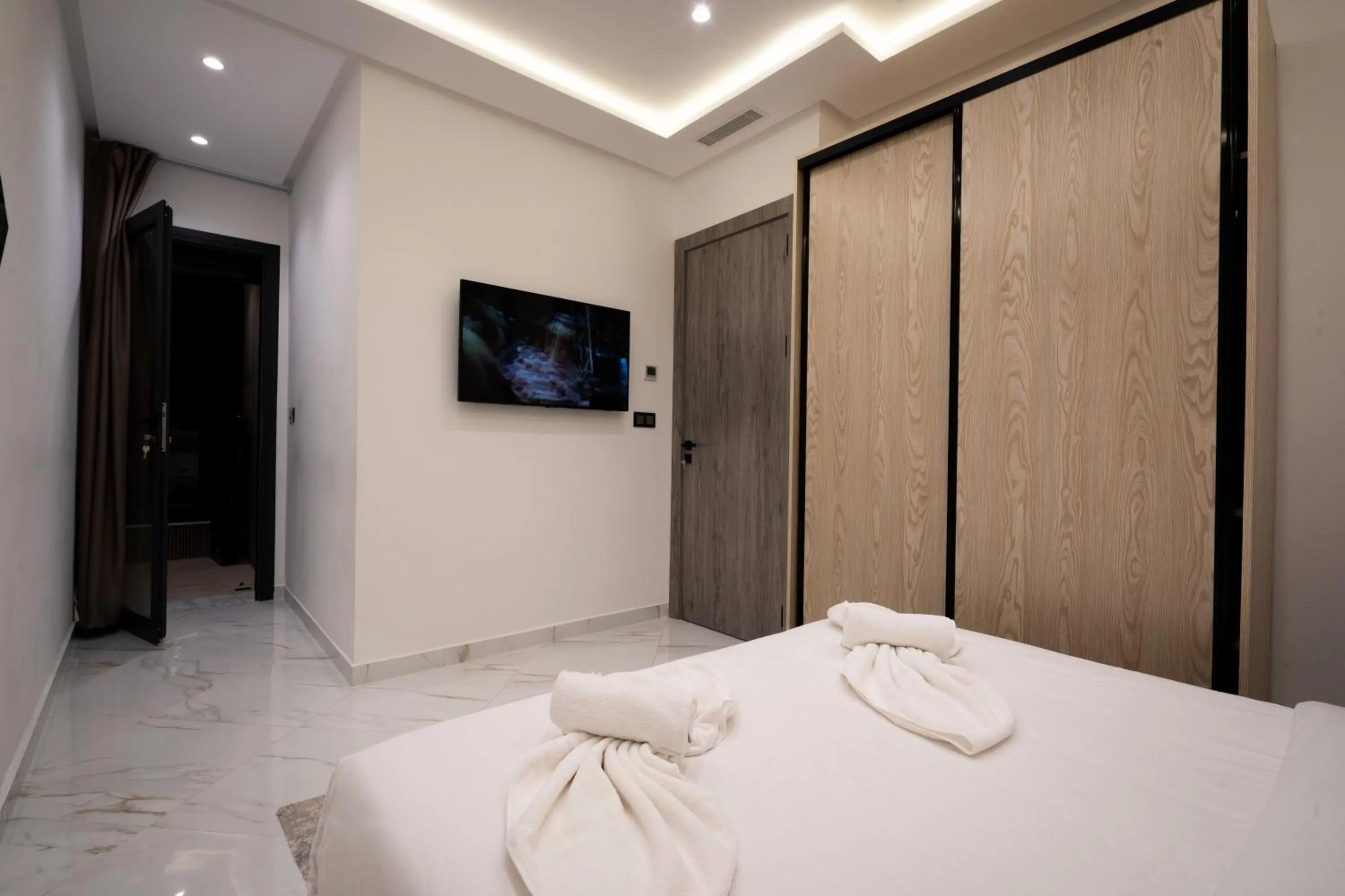 Bed in Living Appart-Hotel