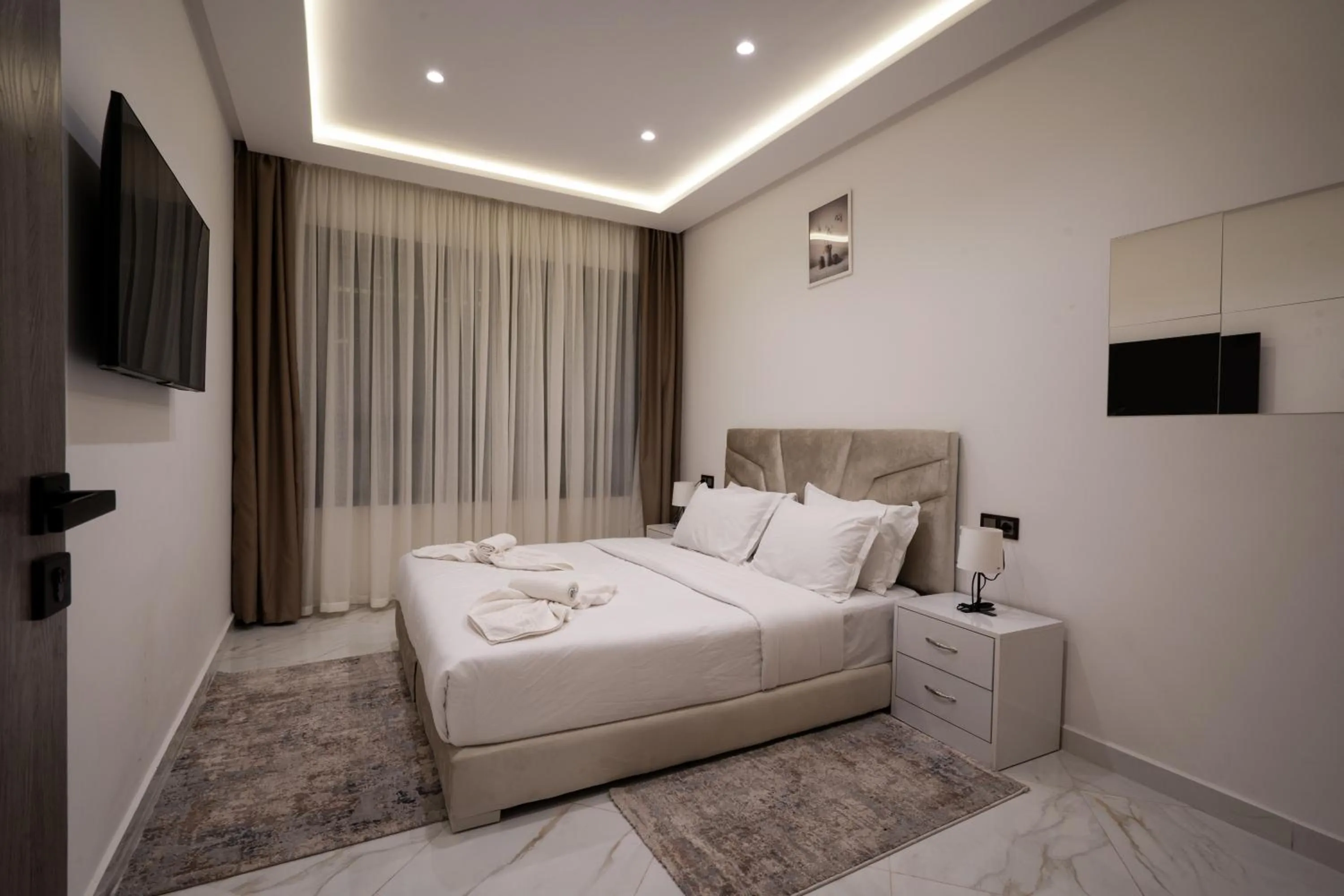 Bed in Living Appart-Hotel