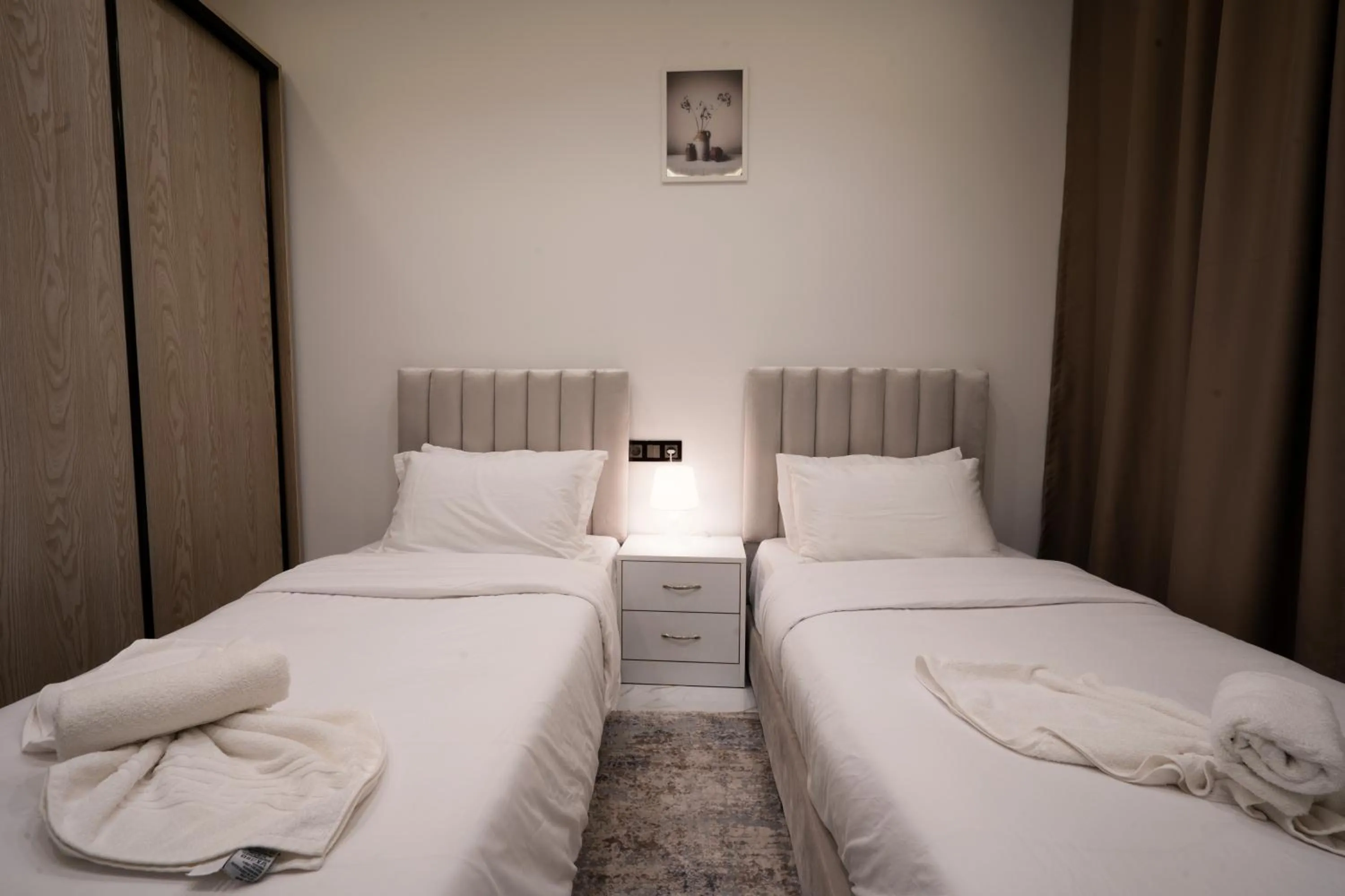 Bed in Living Appart-Hotel