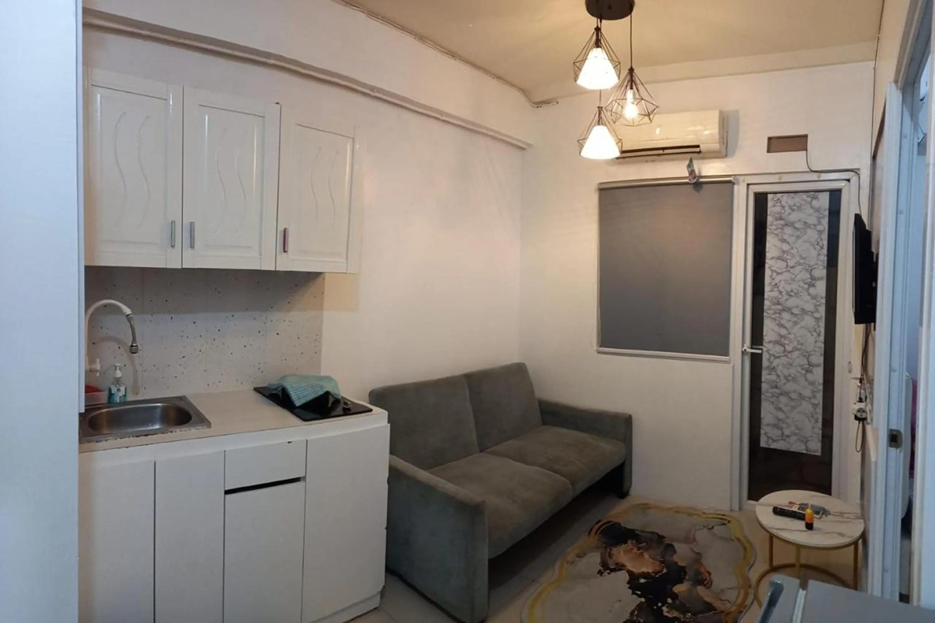 Living room in Green Pramuka by Uchi Property