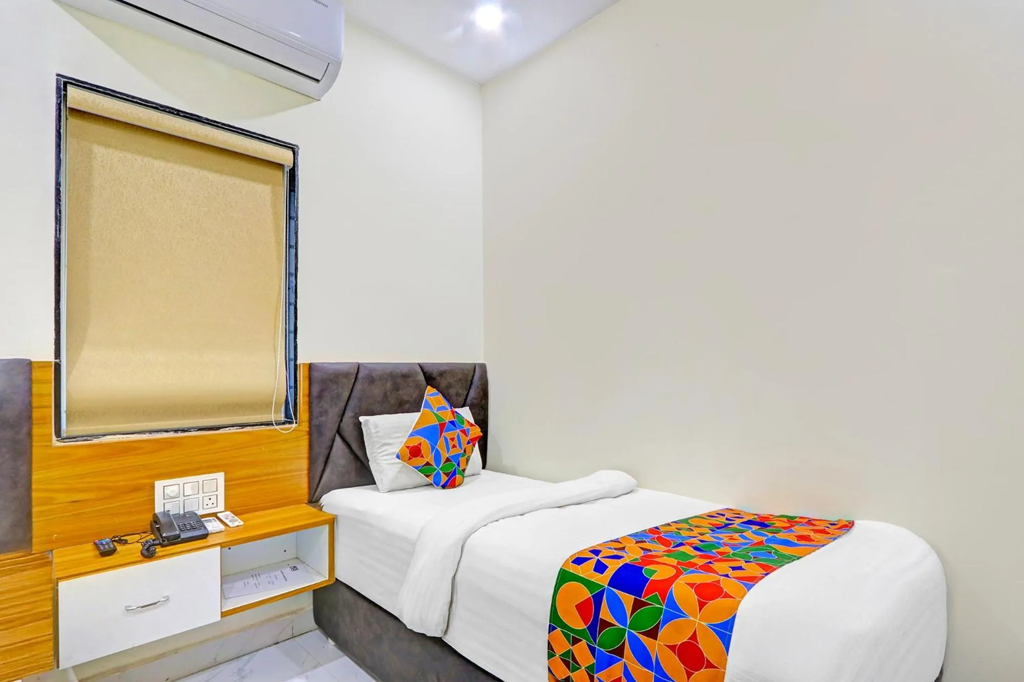 Bed in FabHotel Dharani Grand - Nr Mamata Medical College