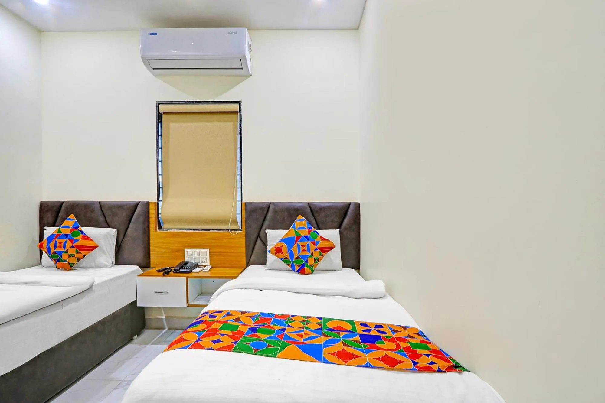 Bed in FabHotel Dharani Grand - Nr Mamata Medical College
