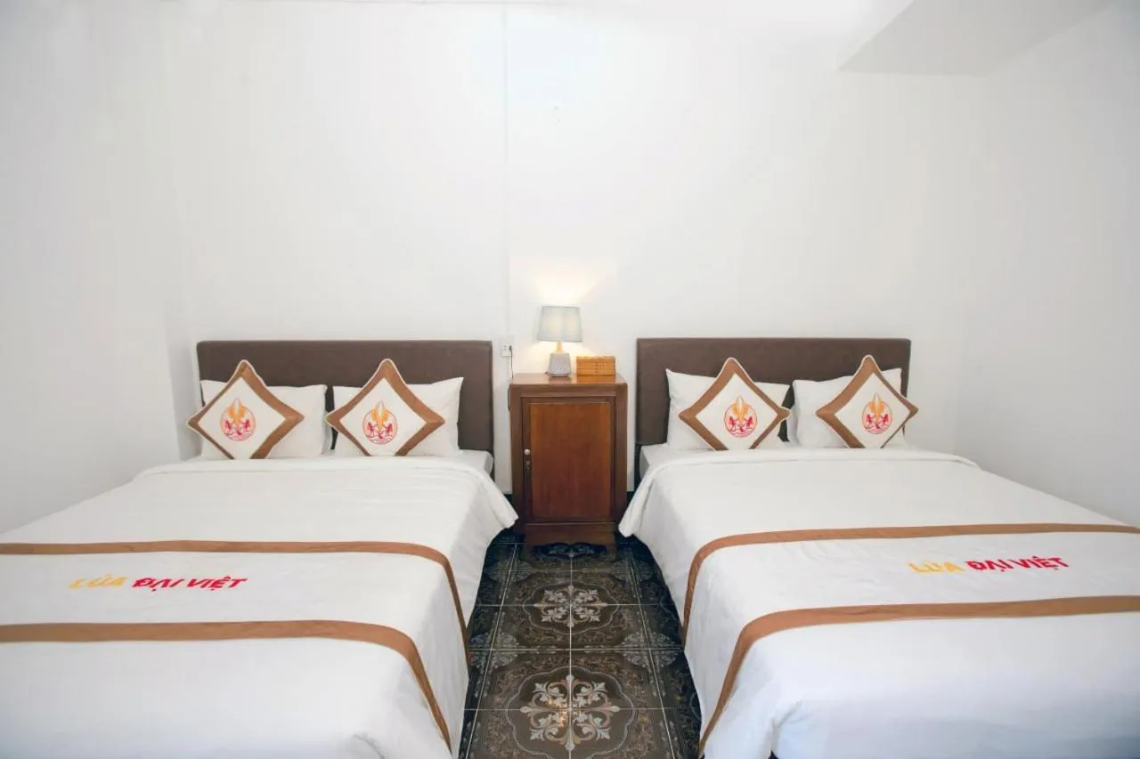 Bed in THE RICE HOTEL Nong Thon Dai Viet 131 Bui Vien