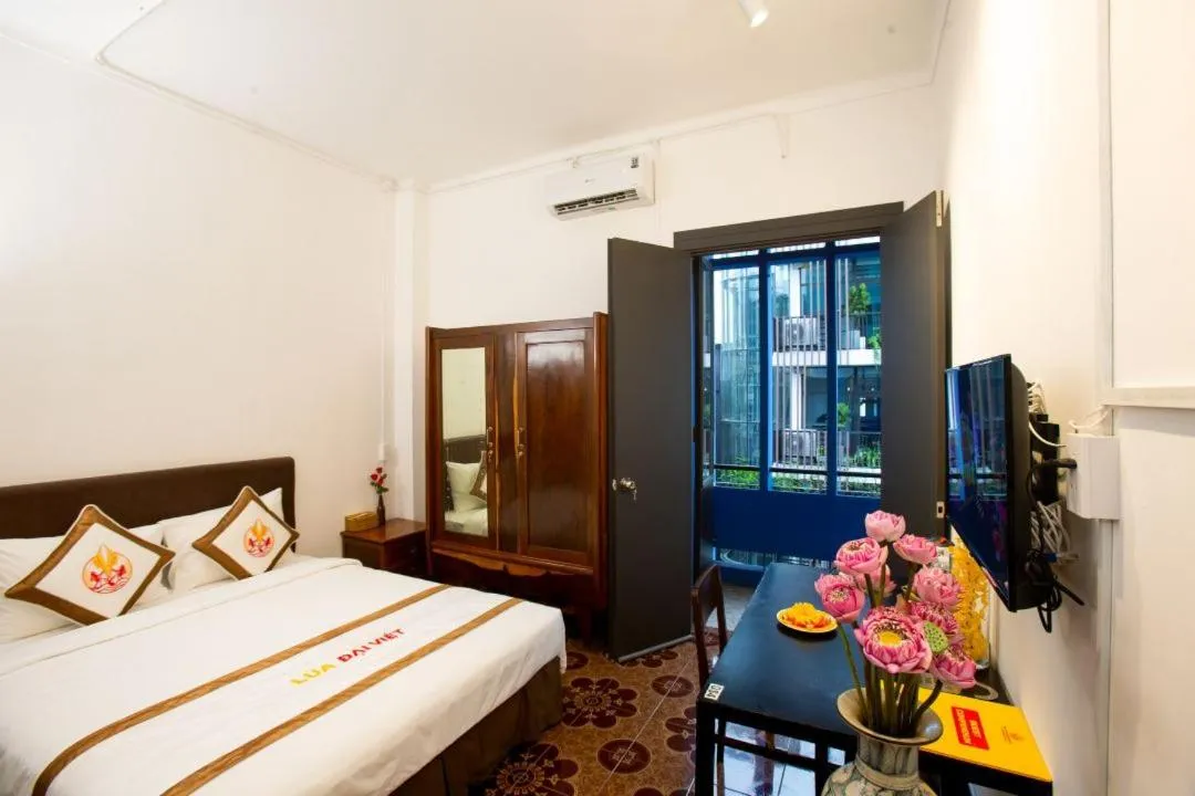 Bed in THE RICE HOTEL Nong Thon Dai Viet 131 Bui Vien