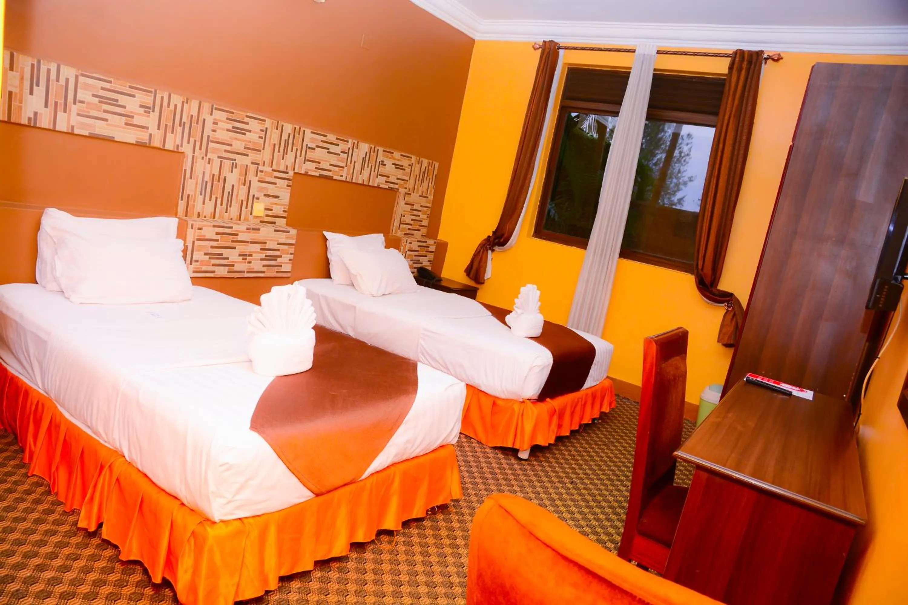 Bed in The Country Inn Hotel