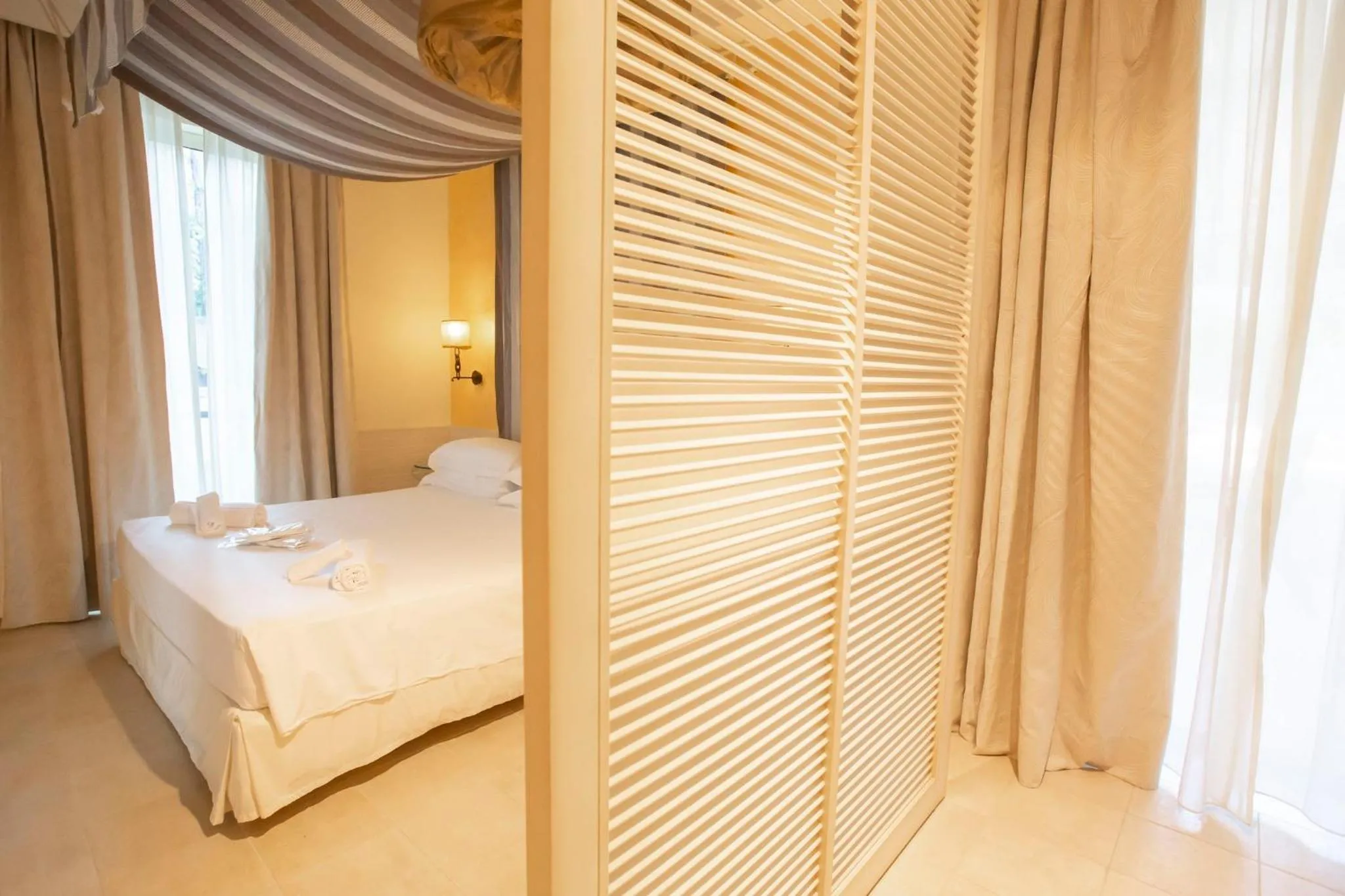 Bed in AH Premium Baia dei Faraglioni