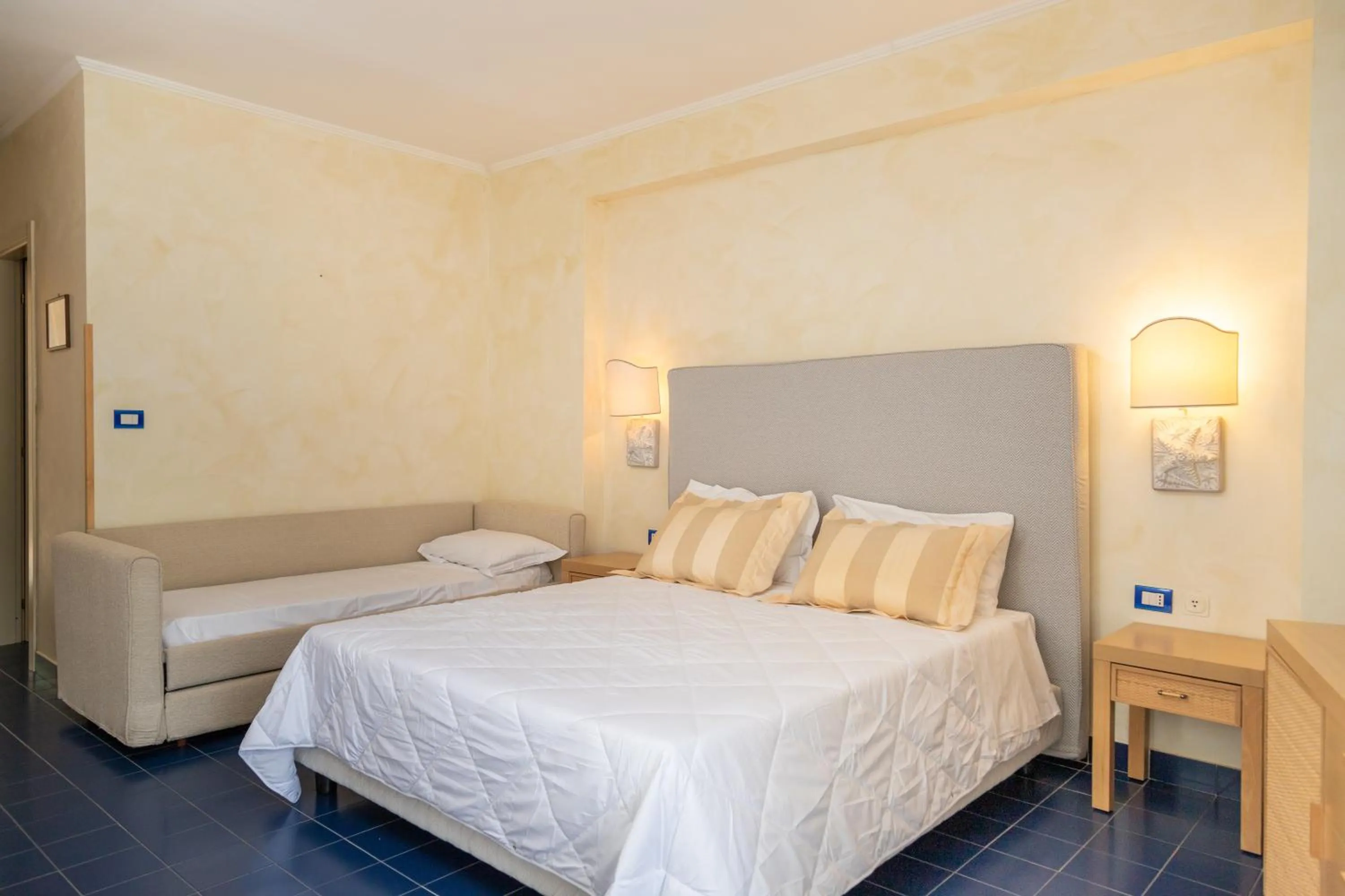 Bed in AH Premium Baia dei Faraglioni