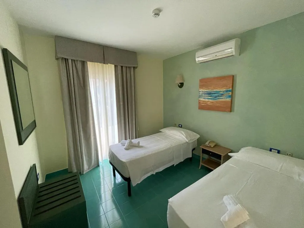 Bed in AH Premium Baia dei Faraglioni