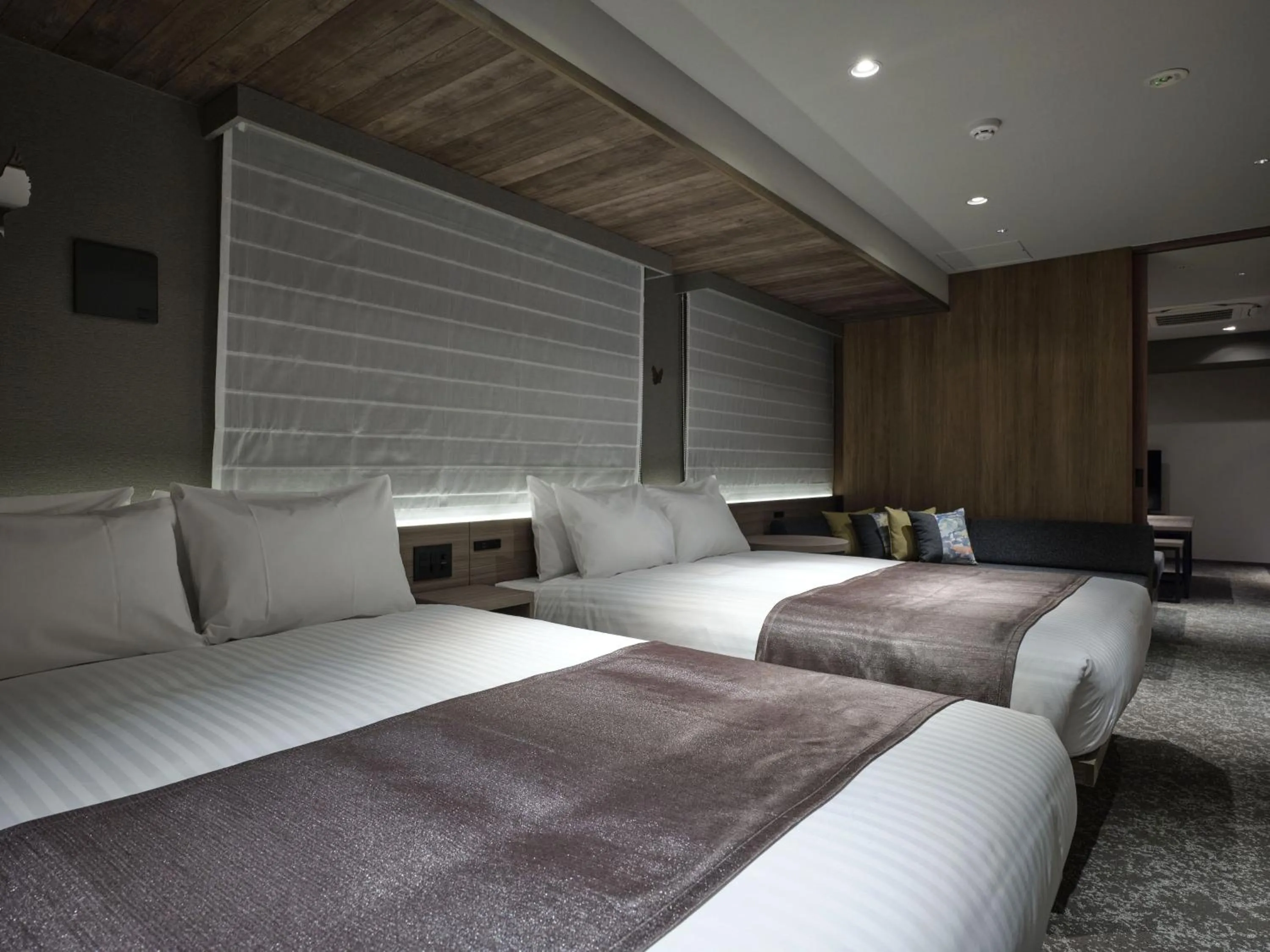 Bed in MONday Apart Premium Kyoto Sta Kamogawa