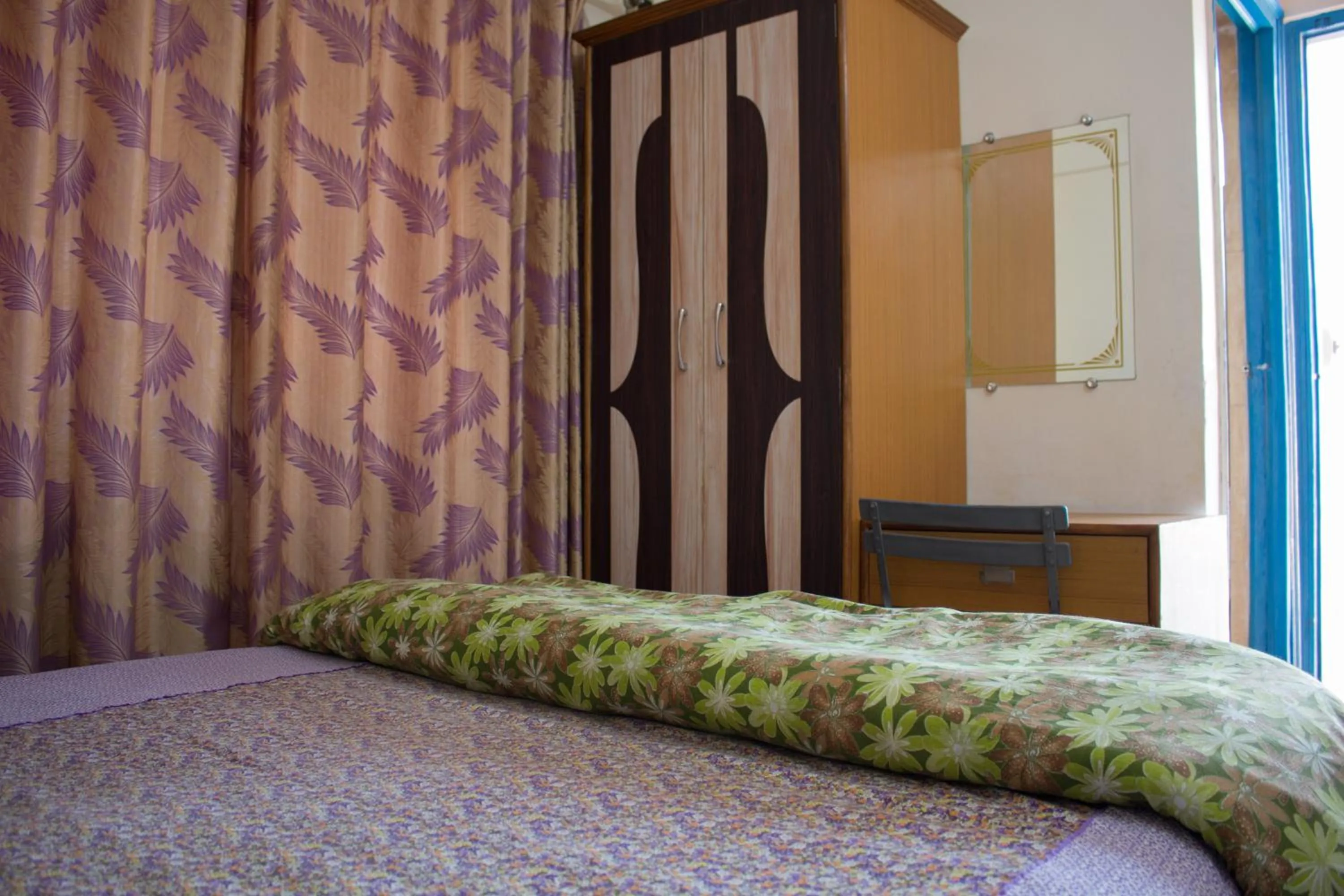 Photo of the whole room in Hotel Golden Crown Laxman Jhula