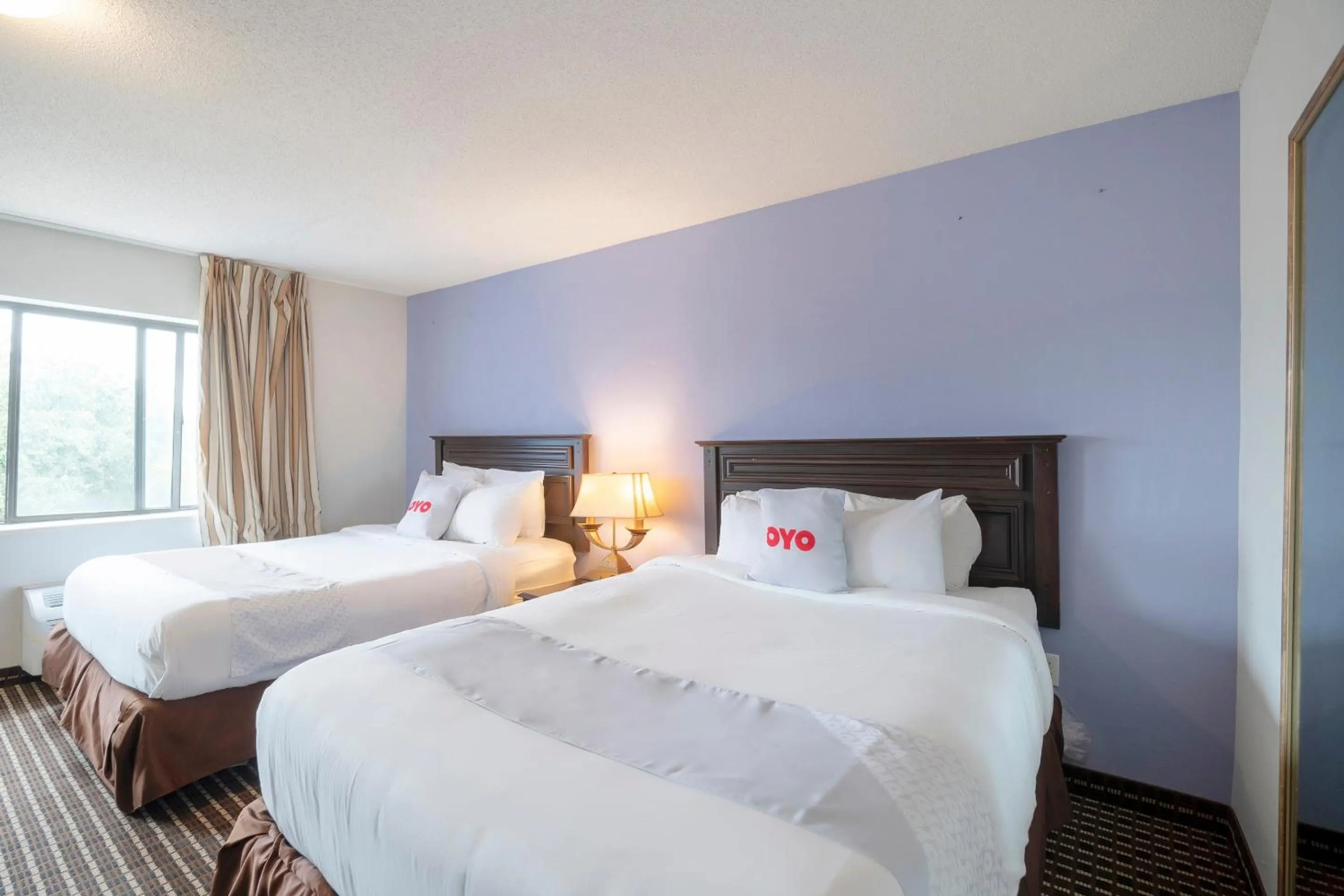 Bedroom, Bed in OYO Townhouse Houston Airport North