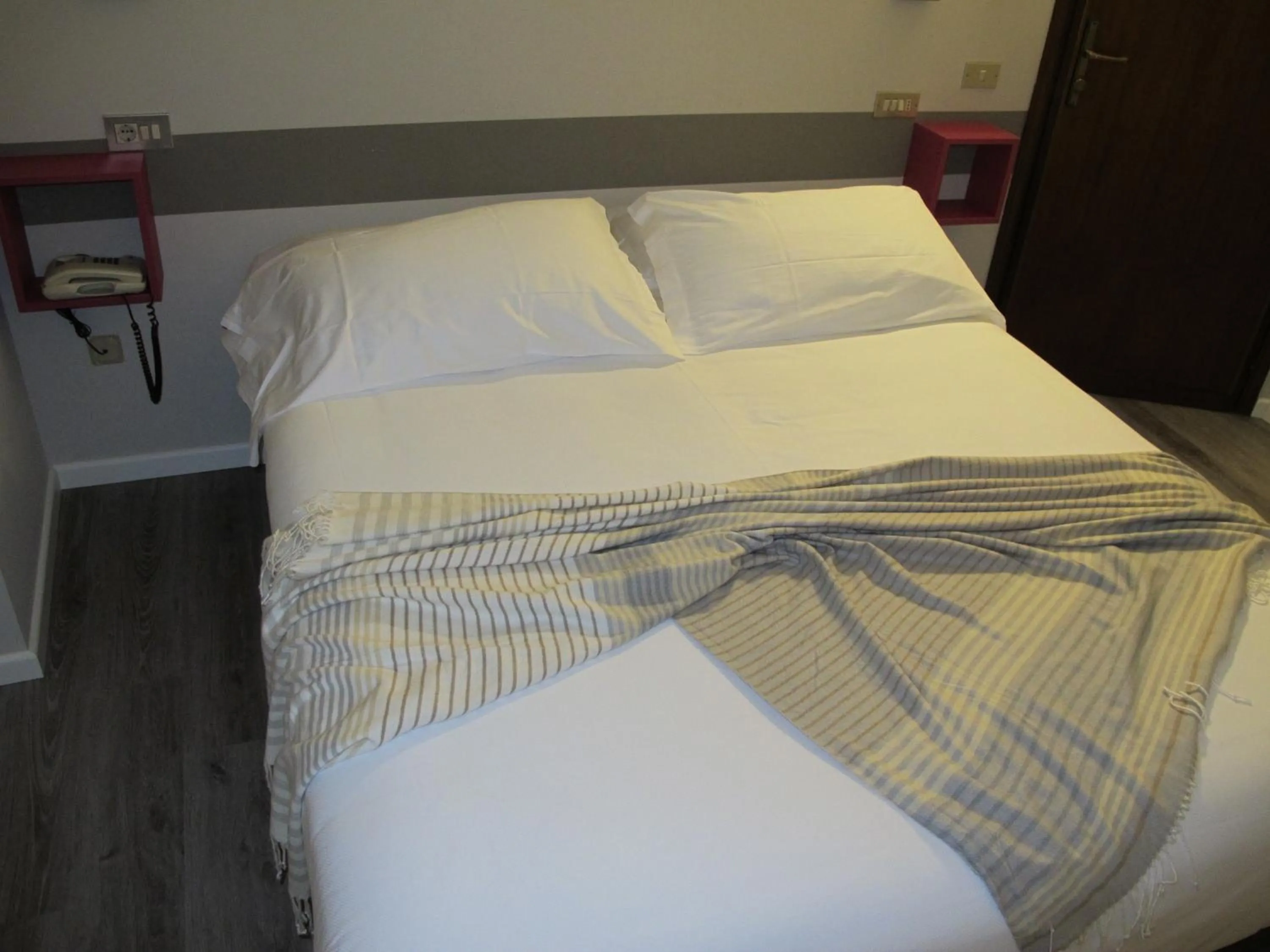 Bed in Albergo Al Cacciatore Tortellinando