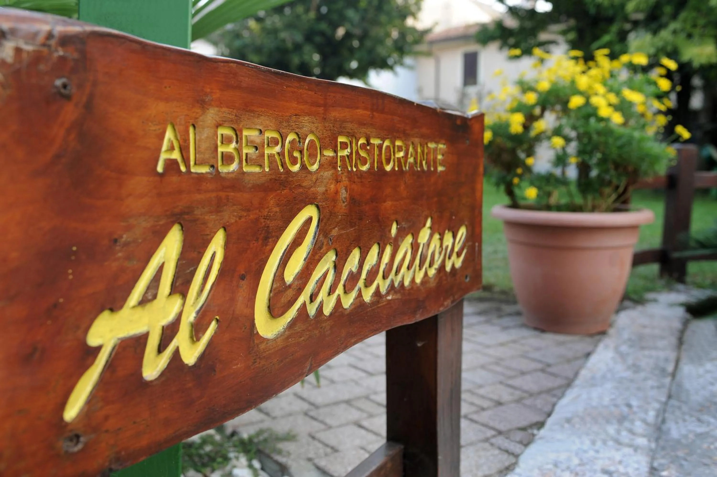 Property logo or sign in Albergo Al Cacciatore Tortellinando