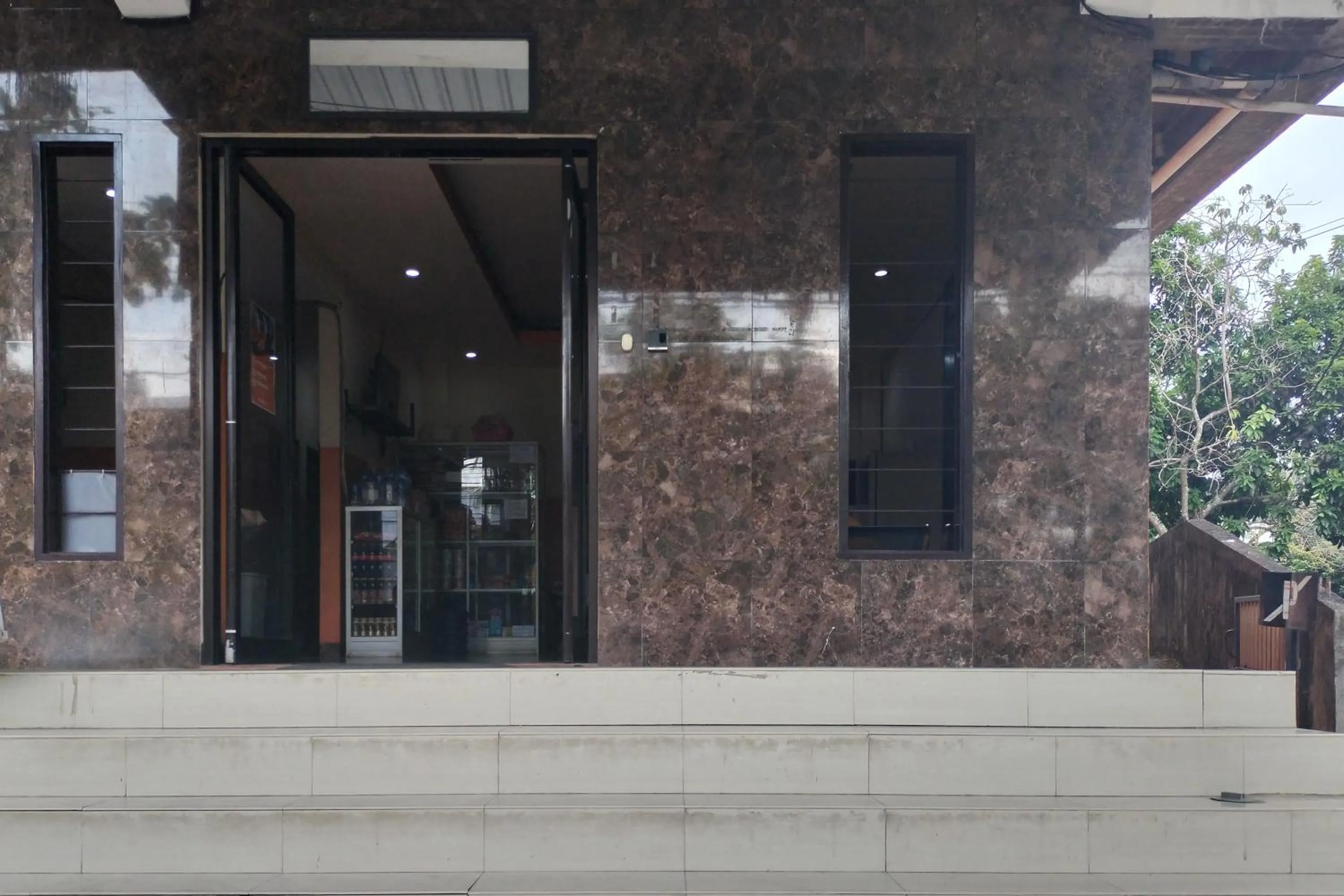 Facade/entrance in RedDoorz at Oxy Residence Manado