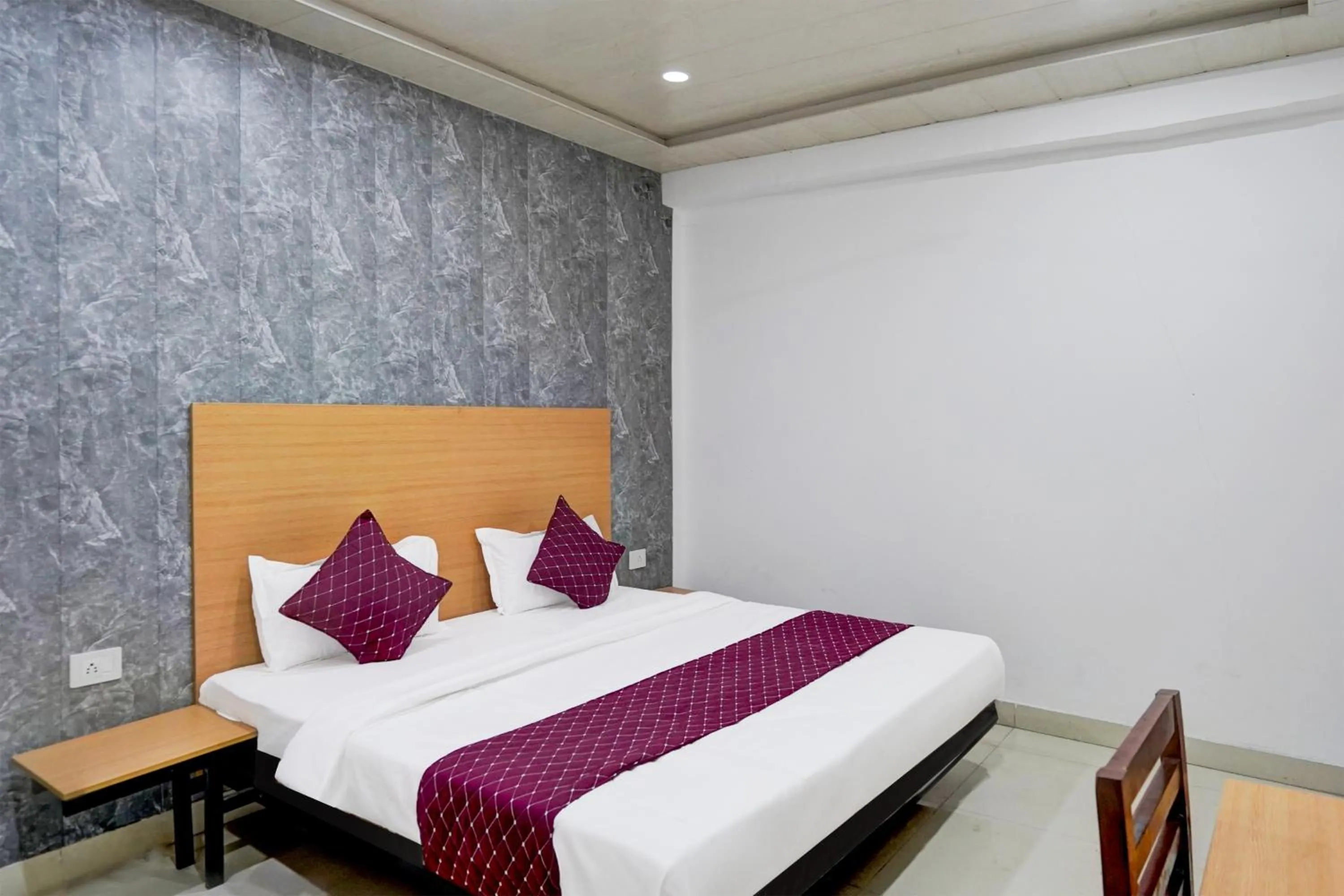 Photo of the whole room, Bed in Hotel Down Town - Noida Sector 15 By Quadis