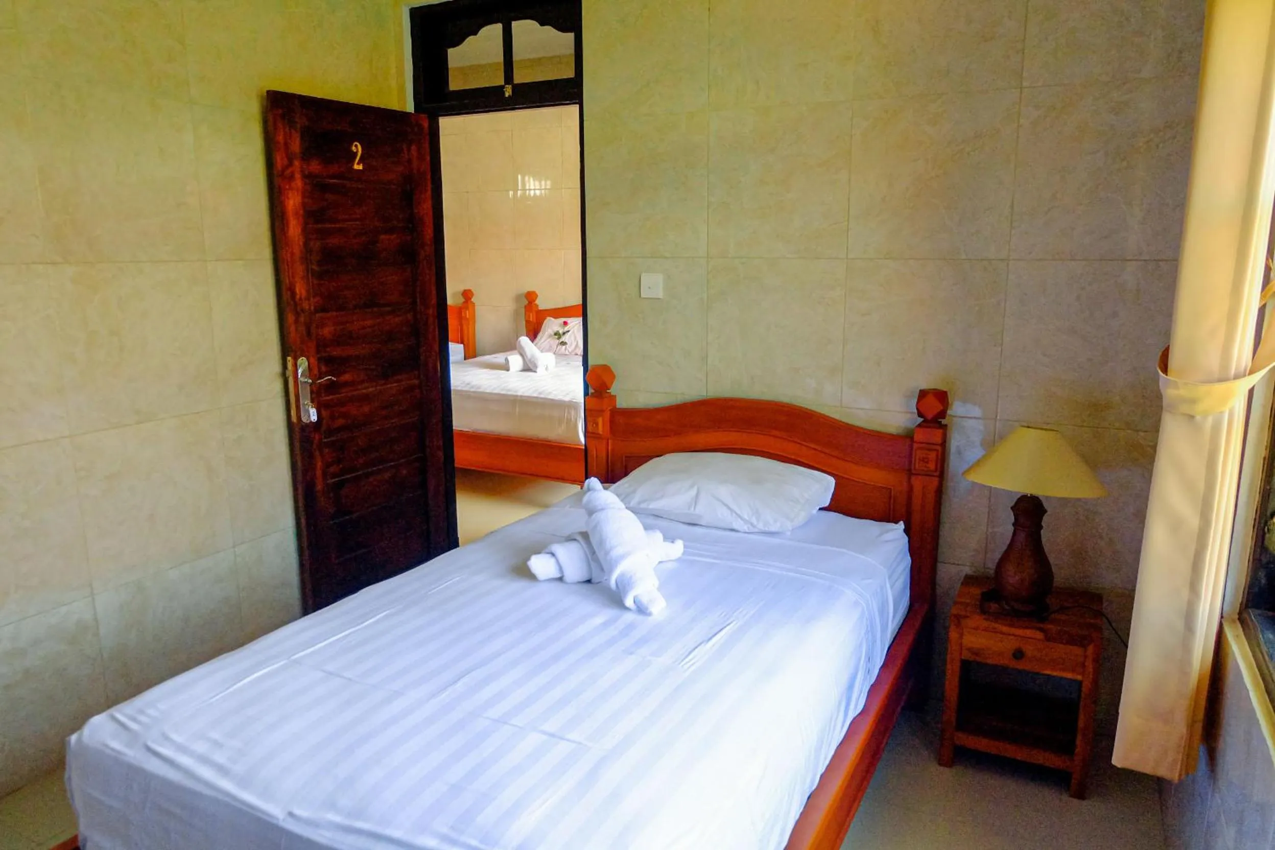 Bed in Adi Homestay