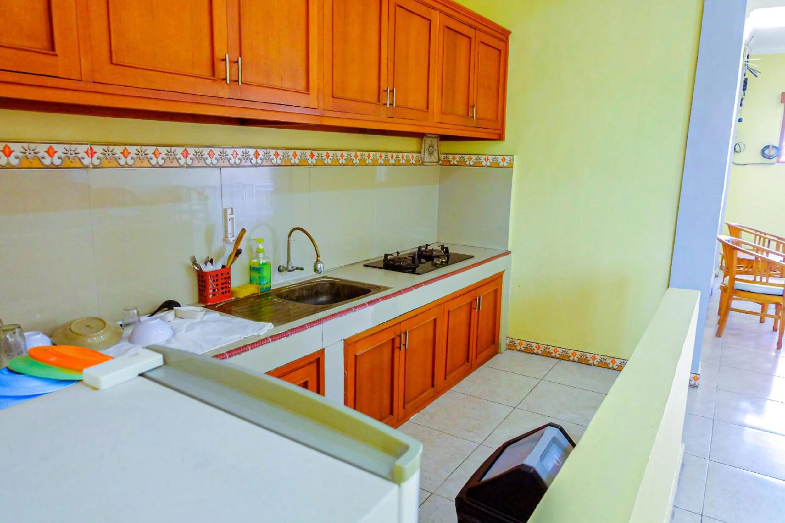 Kitchen or kitchenette in Adi Homestay