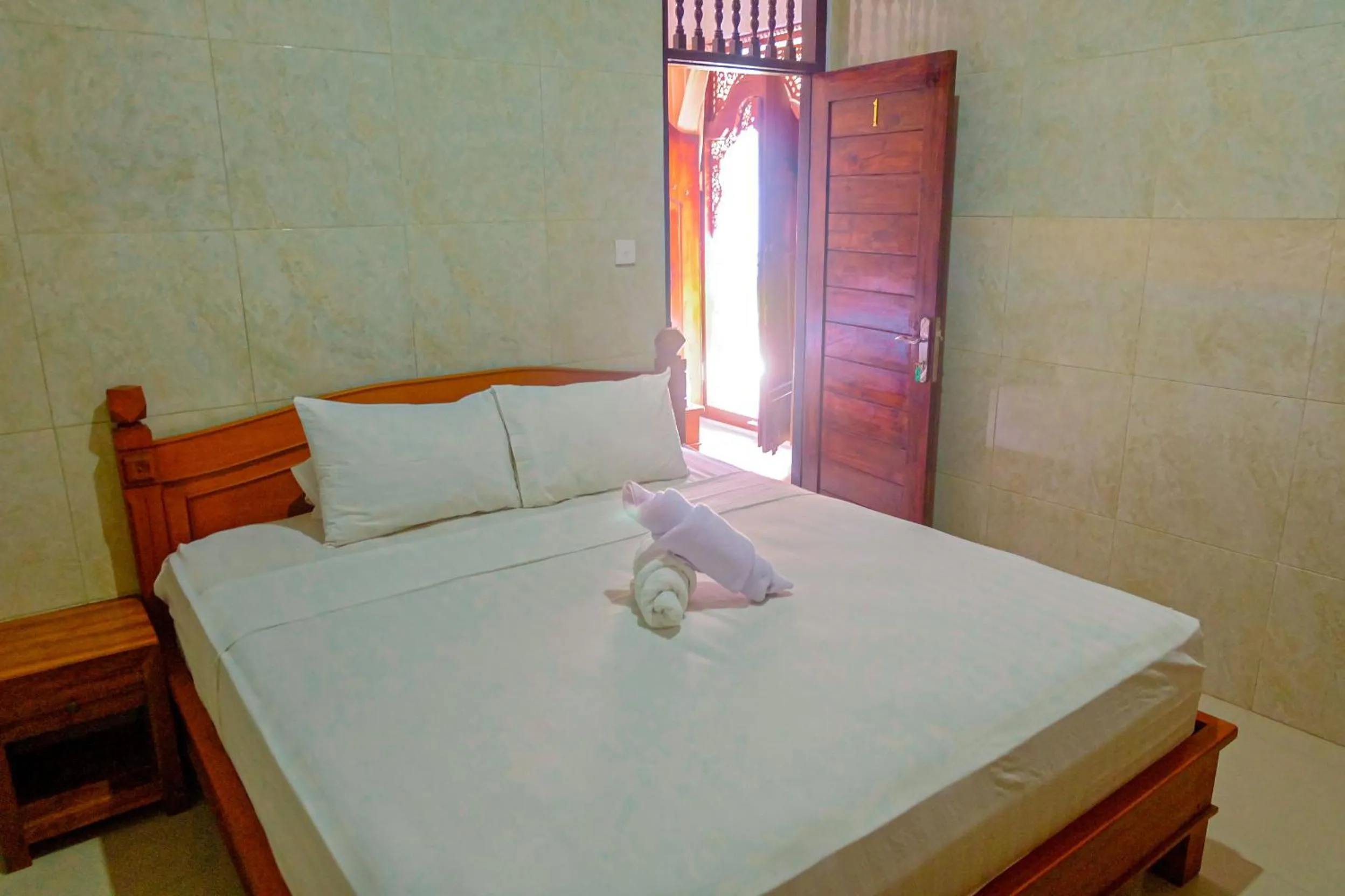 Bed in Adi Homestay