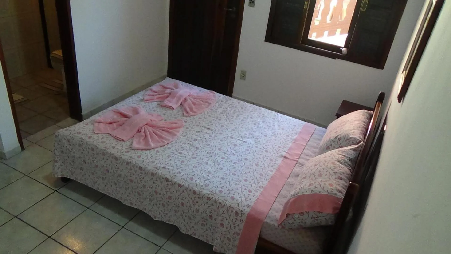 Bed in Pousada Atelier Aly da Costa