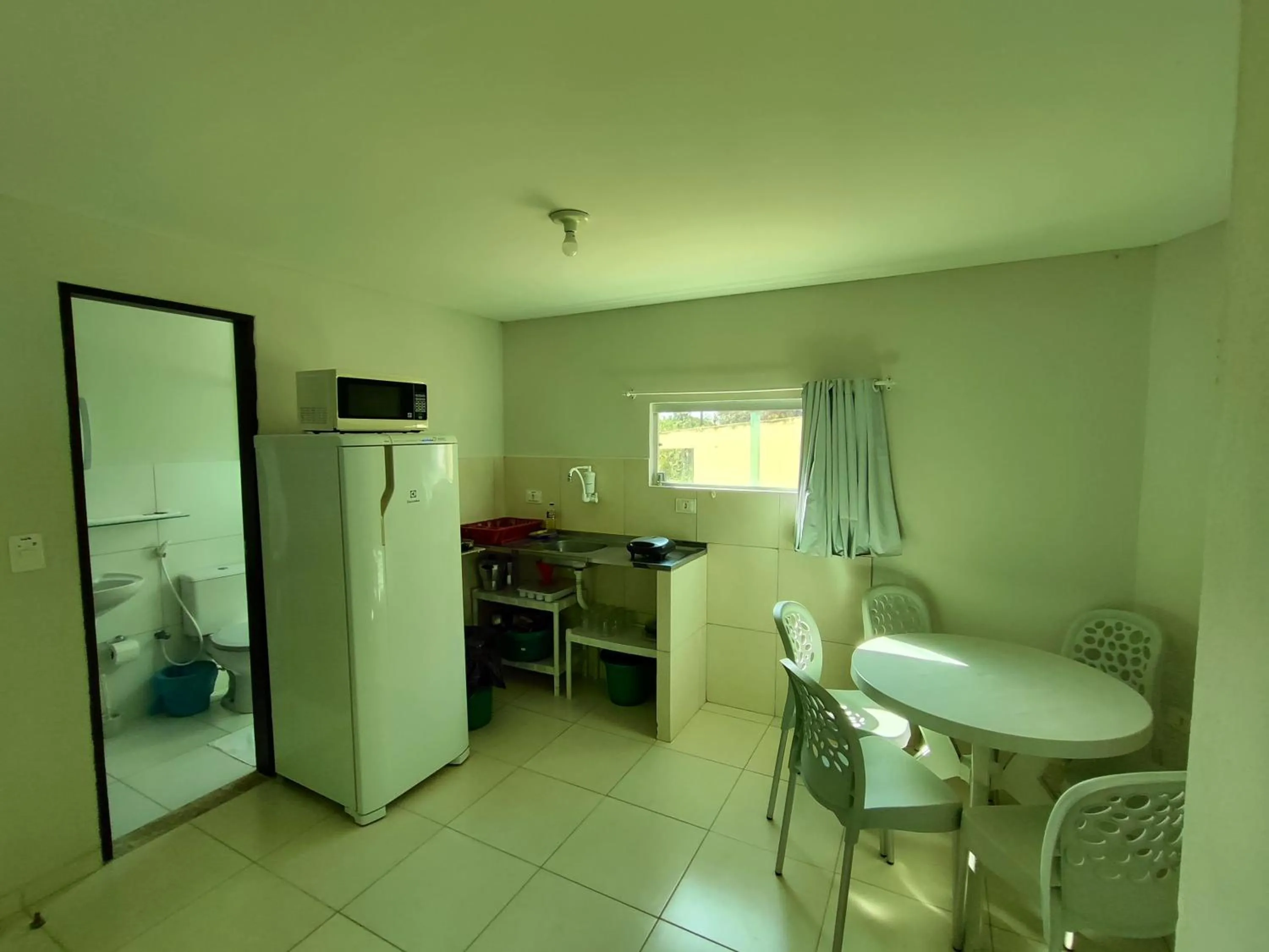 Kitchen or kitchenette in Divinos Flat Carneiros