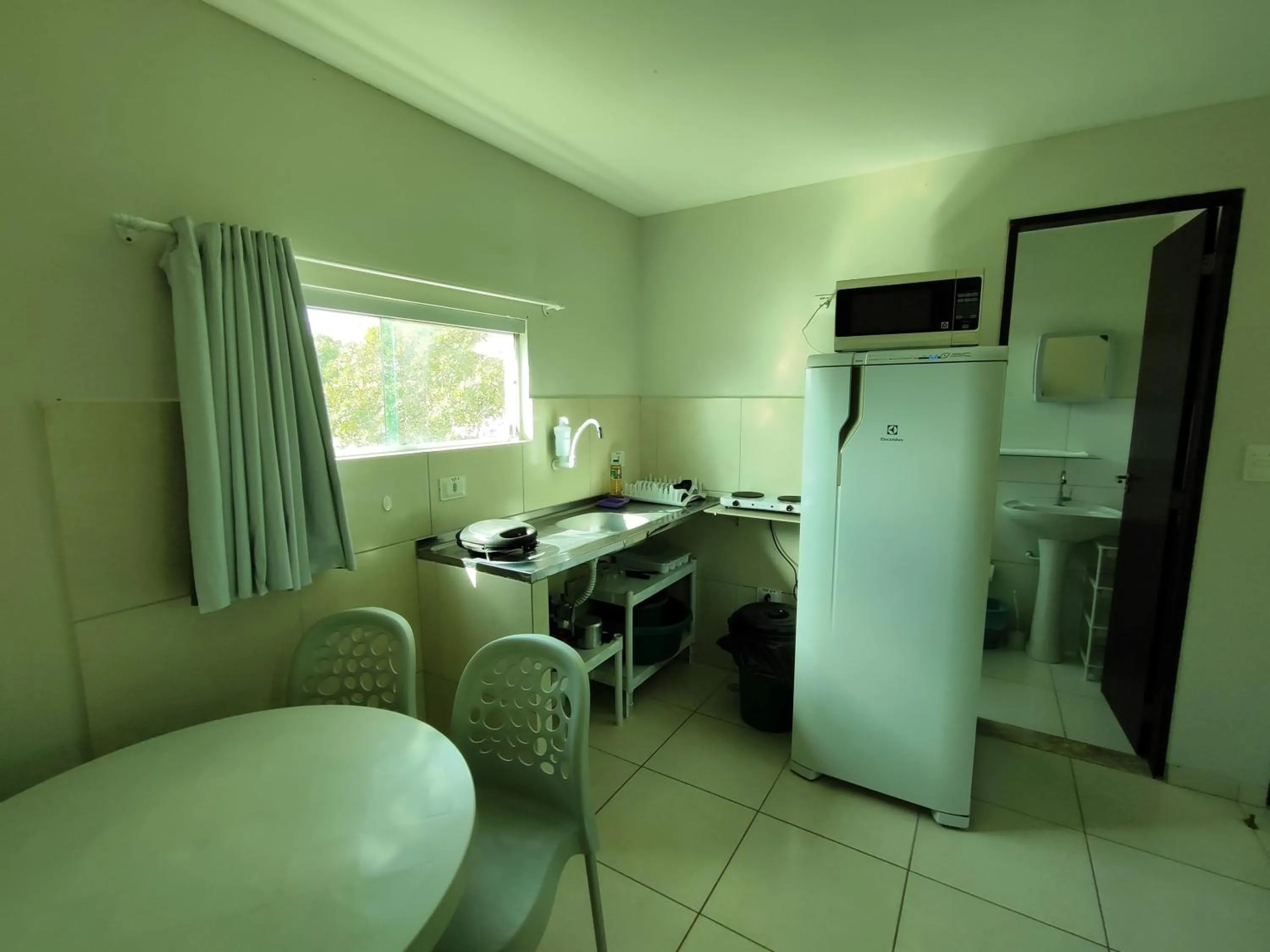 Kitchen or kitchenette in Divinos Flat Carneiros