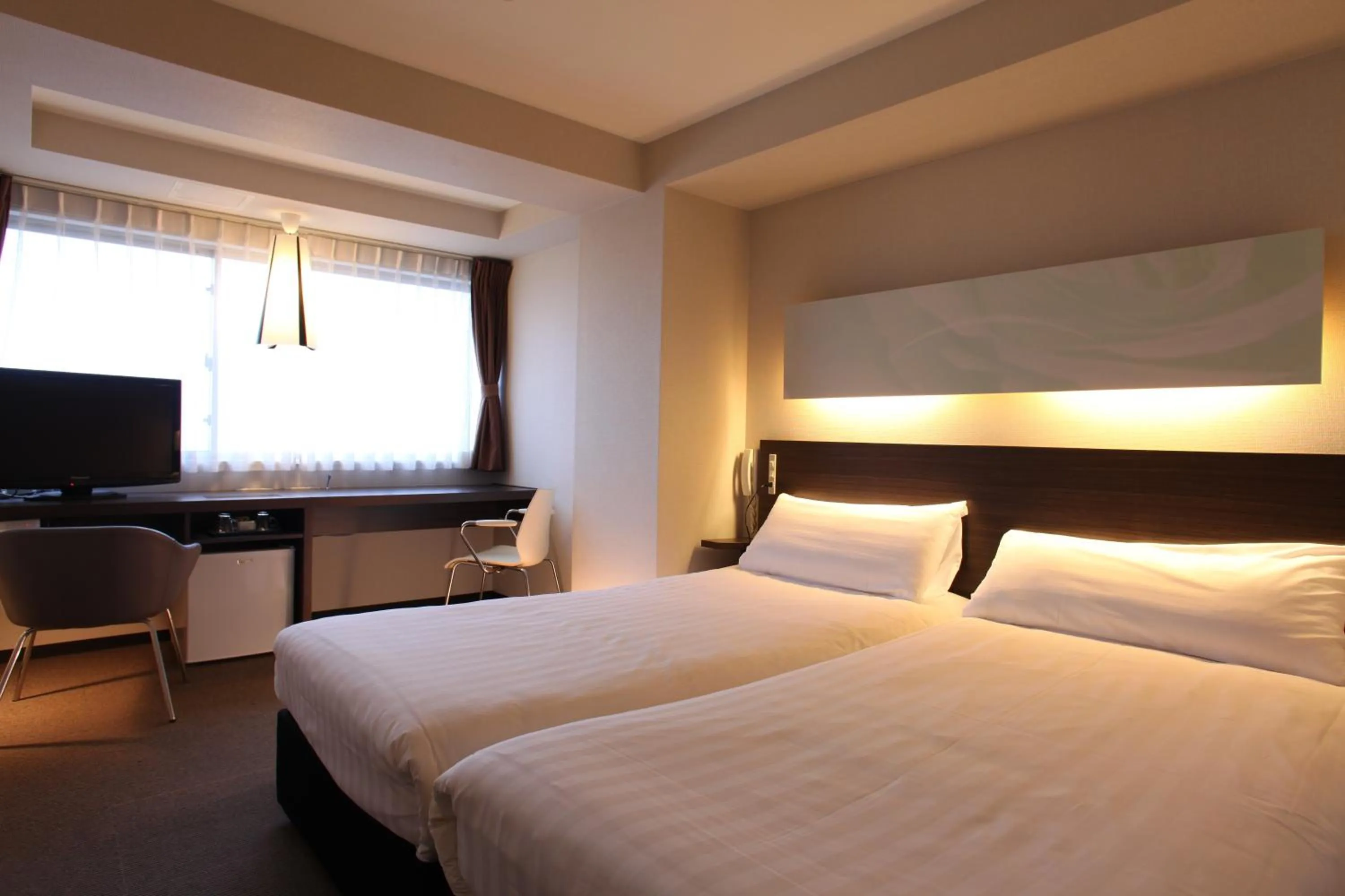 Bedroom, Bed in KOKO HOTEL Numazu Inter