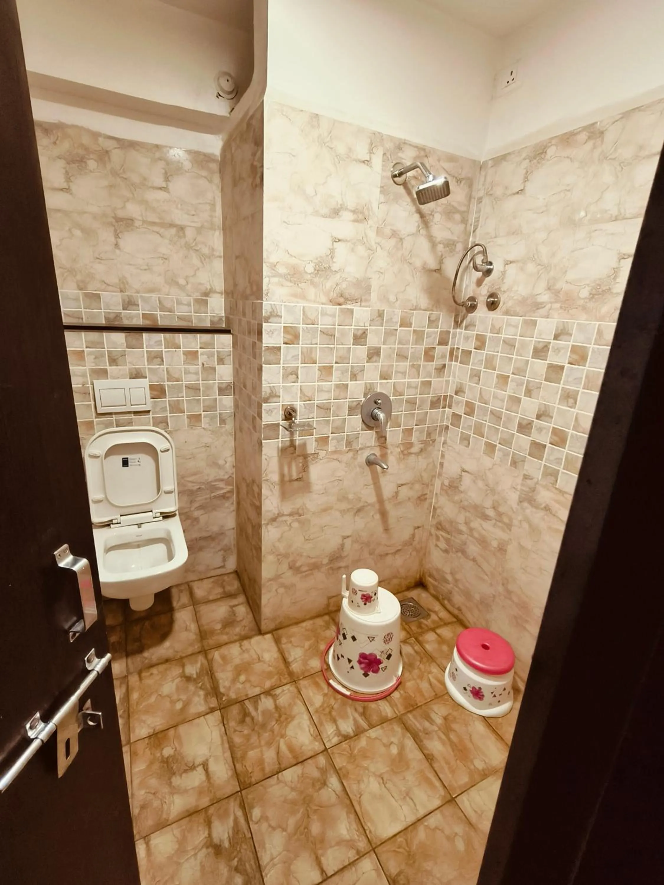 Bathroom in HOTEL MUSHAK by BAPPA PALACE