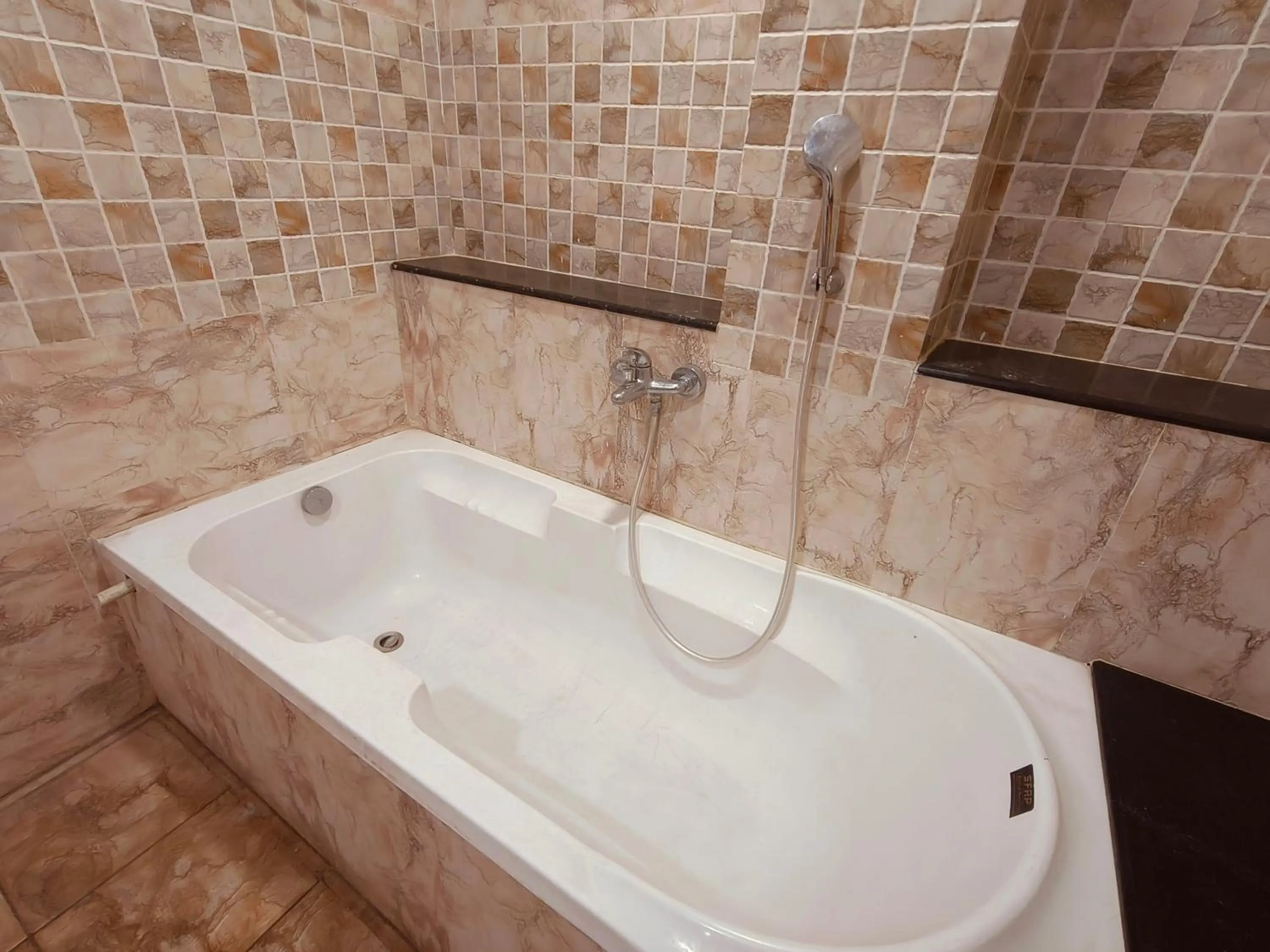 Bathroom in HOTEL MUSHAK by BAPPA PALACE