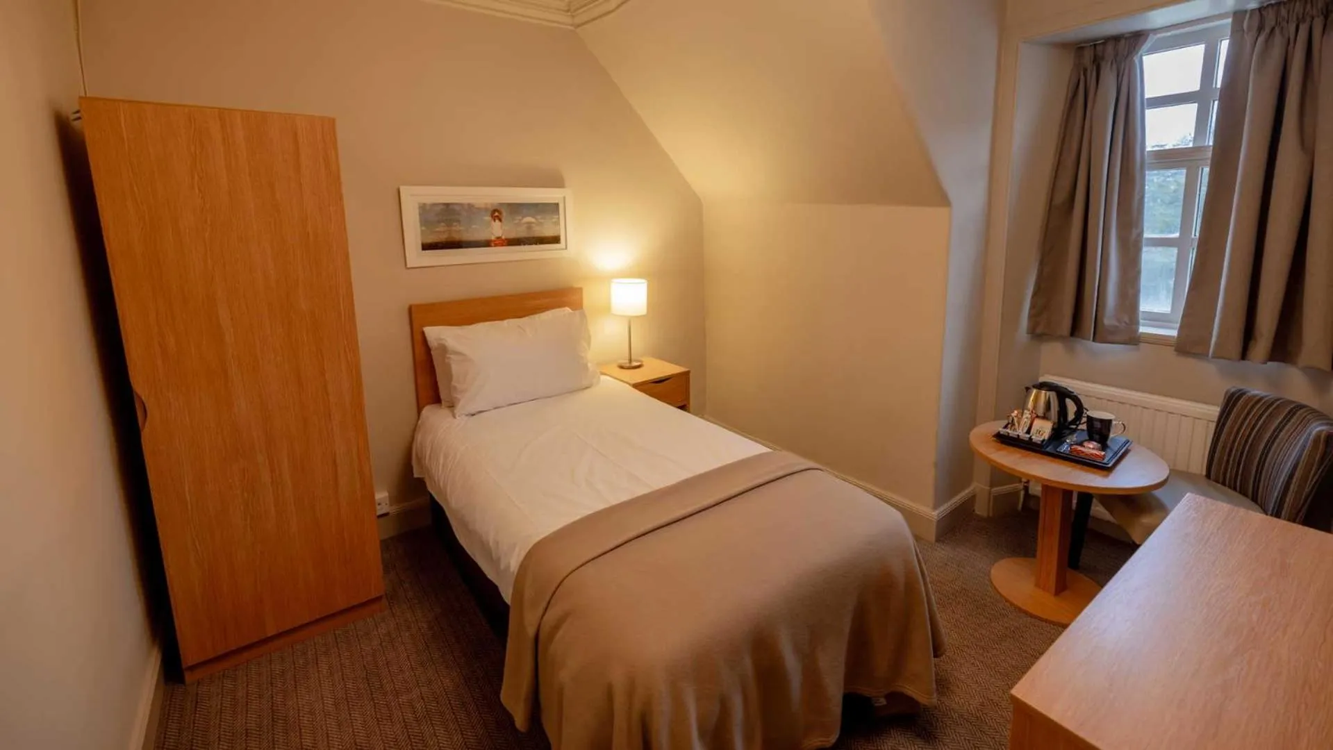 Bed in The Tarbet Hotel