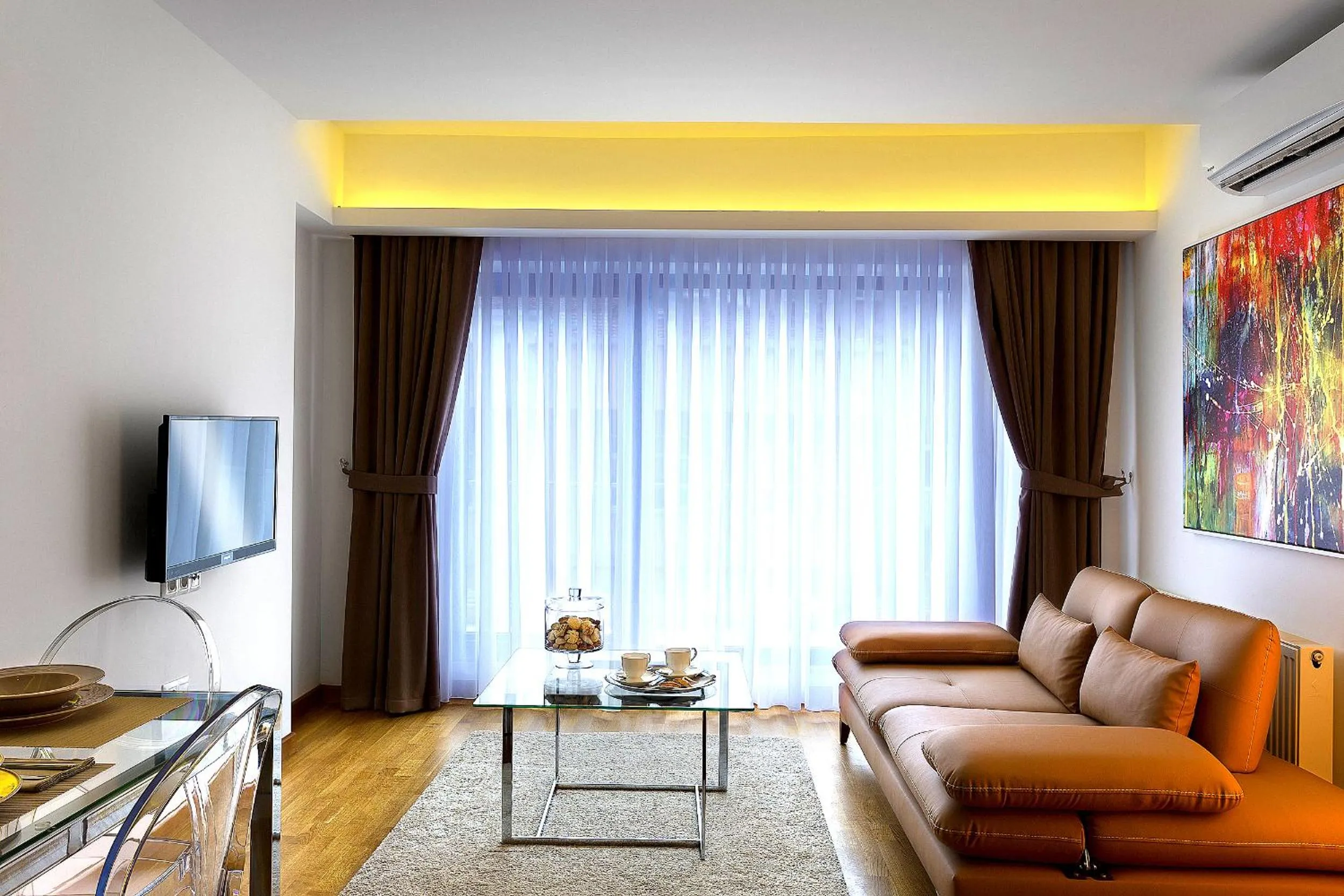 Communal lounge/ TV room in The Place Suit & Apartments