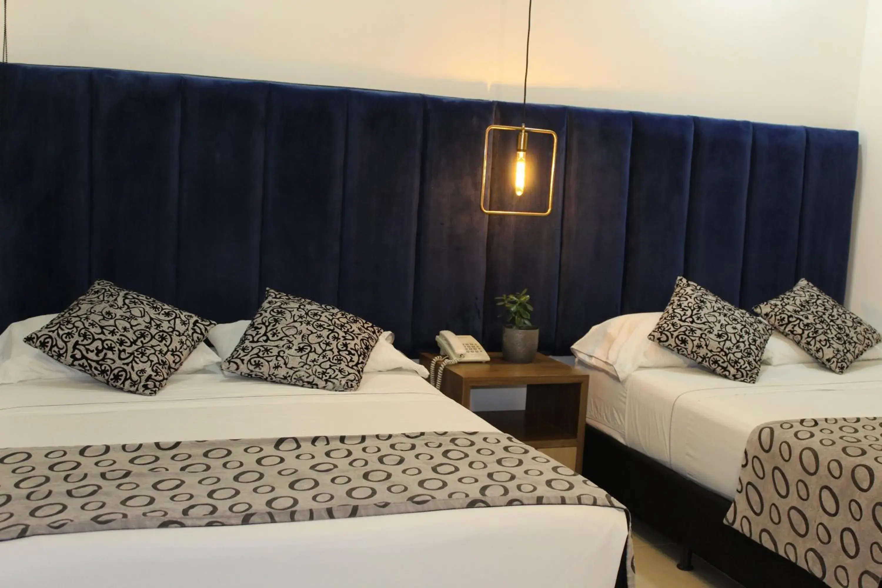 Classic Quadruple Room in Hotel Merlott Lleras Classic Quadruple Room in Hotel Merlott Lleras