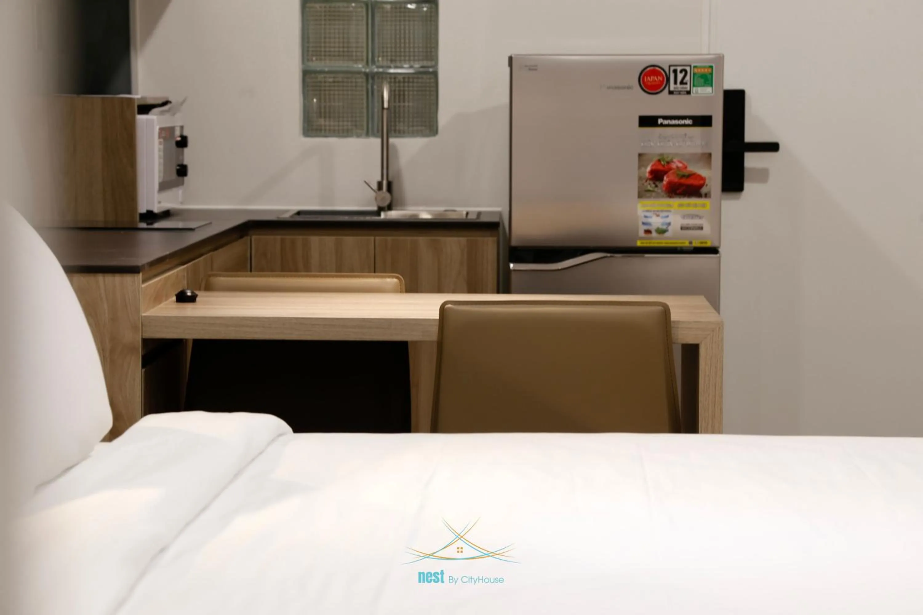 Photo of the whole room, Bed in Cityhouse - Nest Minh Khai