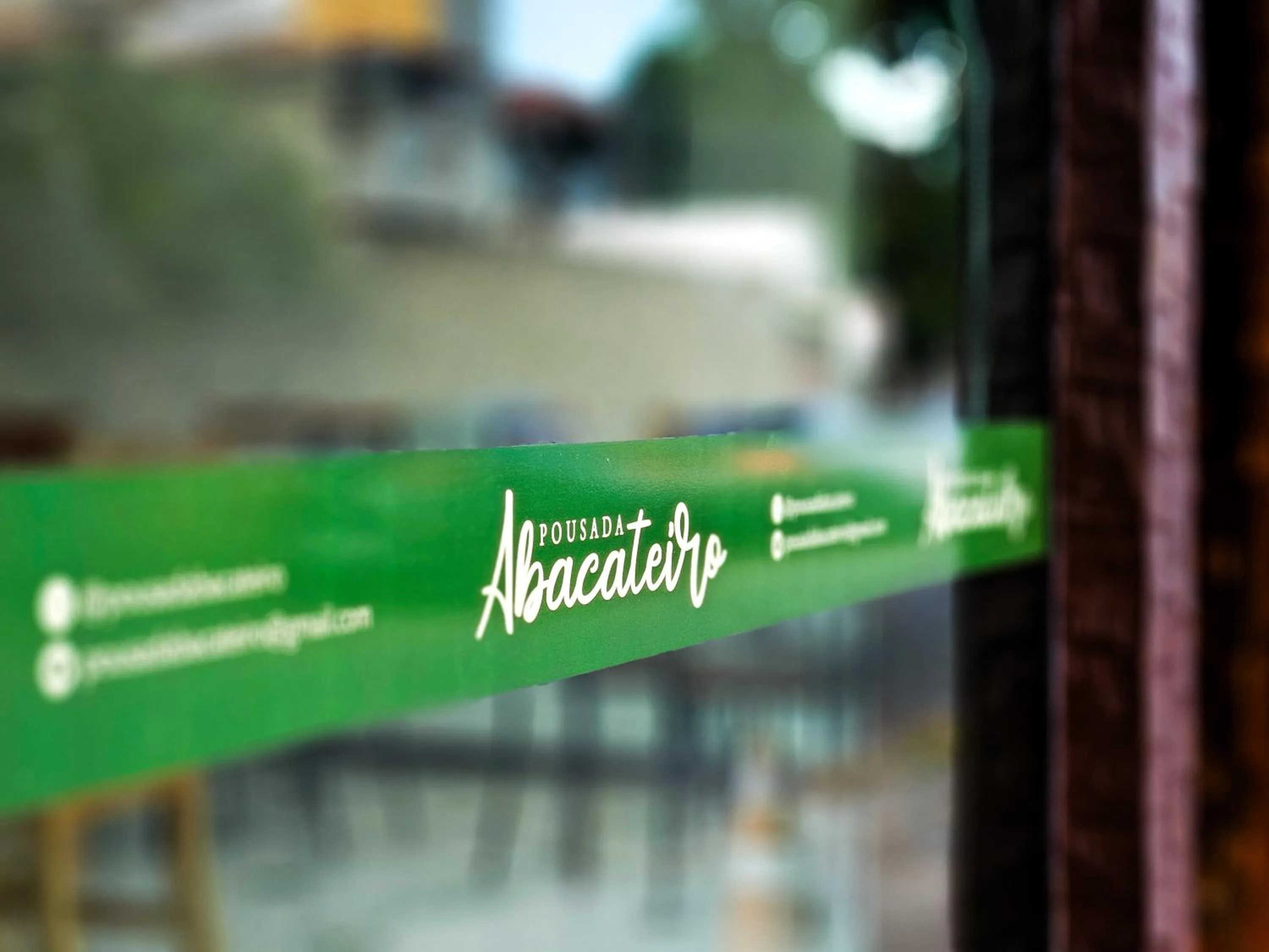 Property logo or sign in Pousada Abacateiro