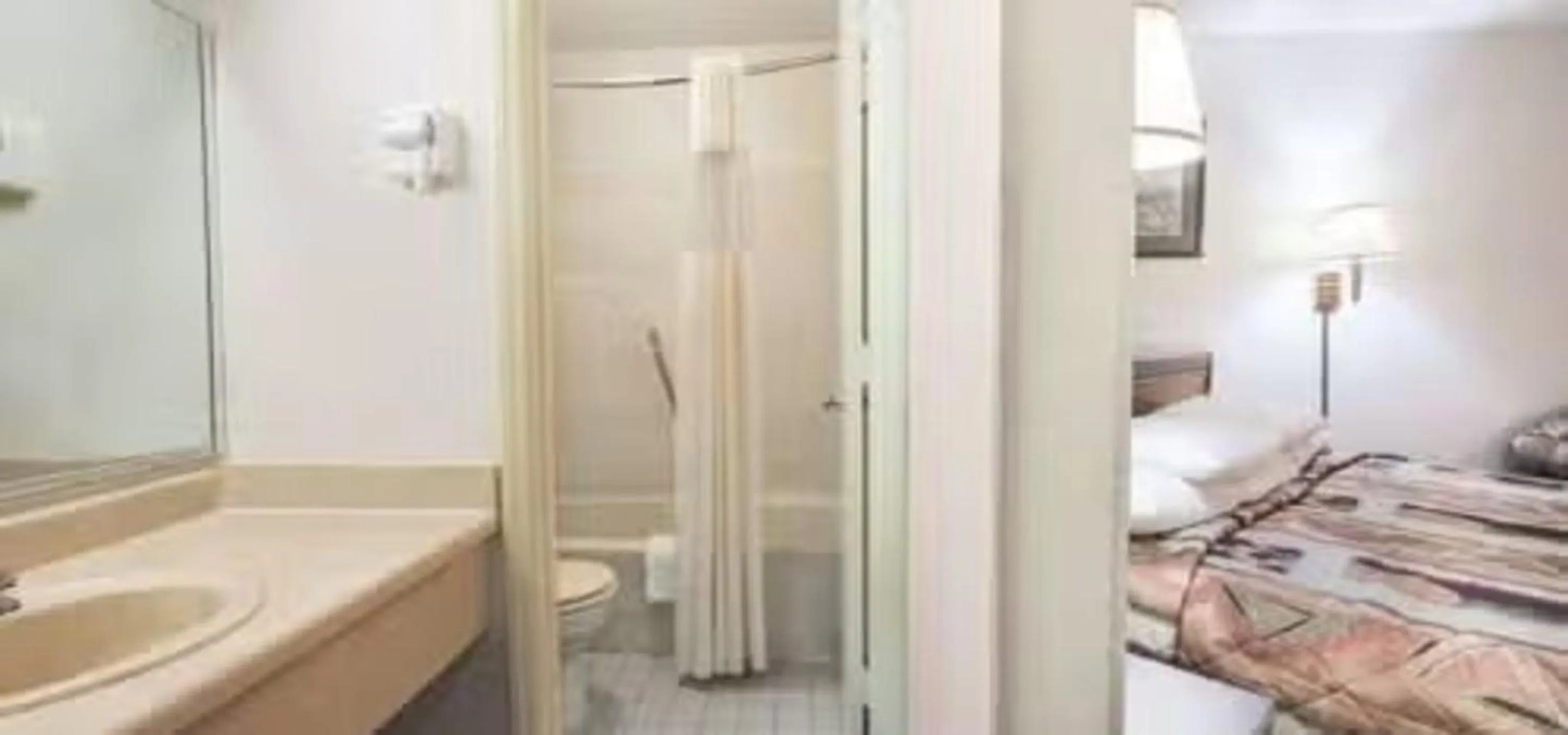 Bathroom, Bed in Studio 6 Suites Charlotte, NC Northlake