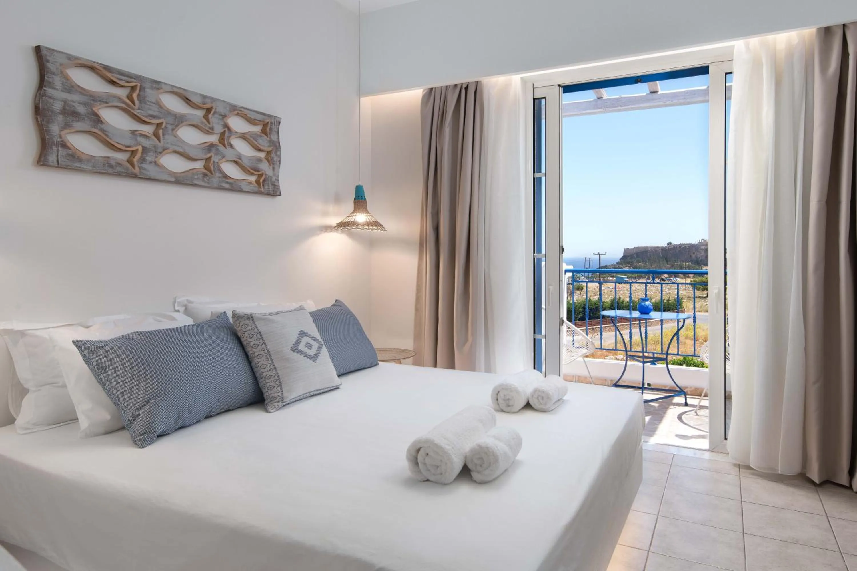 Bed in 'Lindian Myth' Sea View Studios